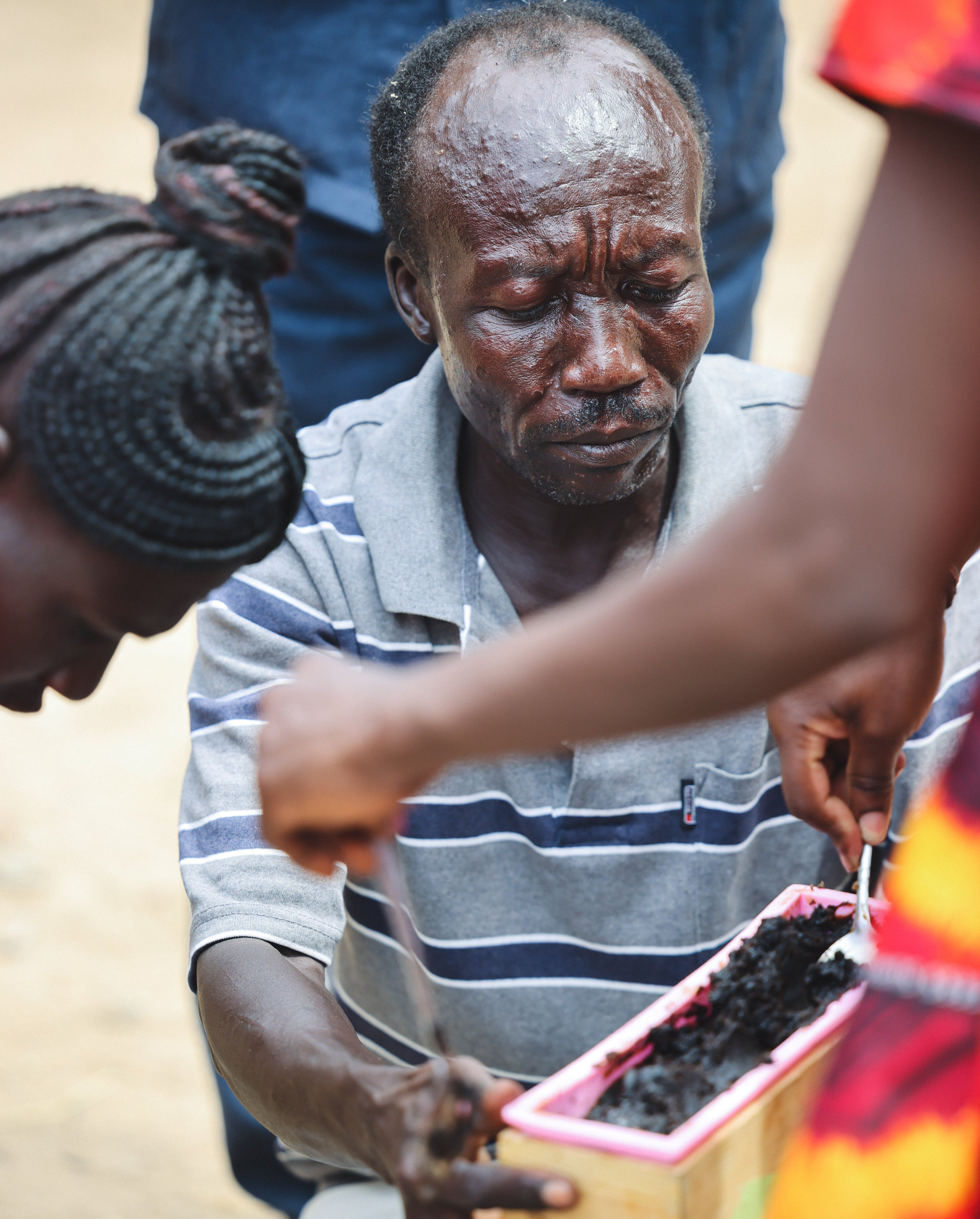man in stripped shirt holding soap