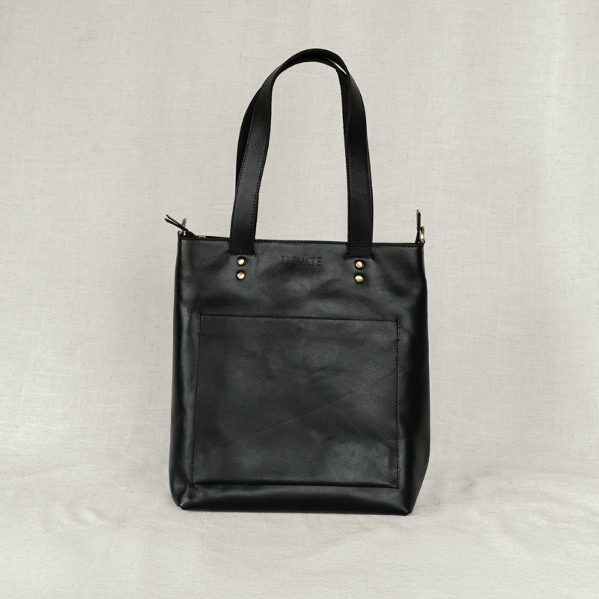 Bucket bag tote displayed on a trendy outfit, combining style and practicality for daily errands.