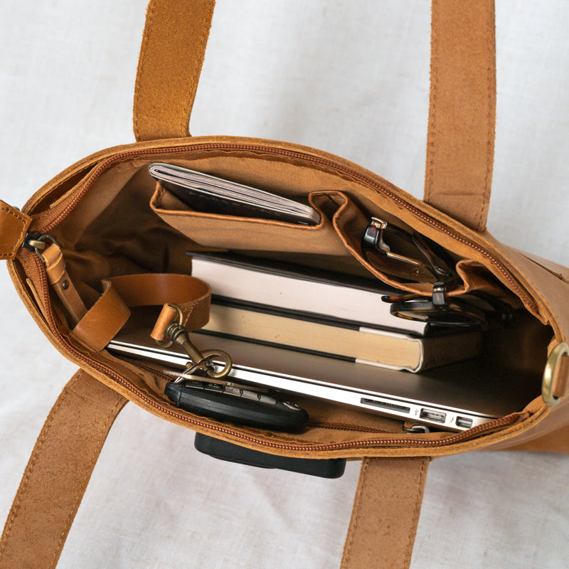 Close-up of the bucket bag tote showcasing high-quality leather and organized interior.