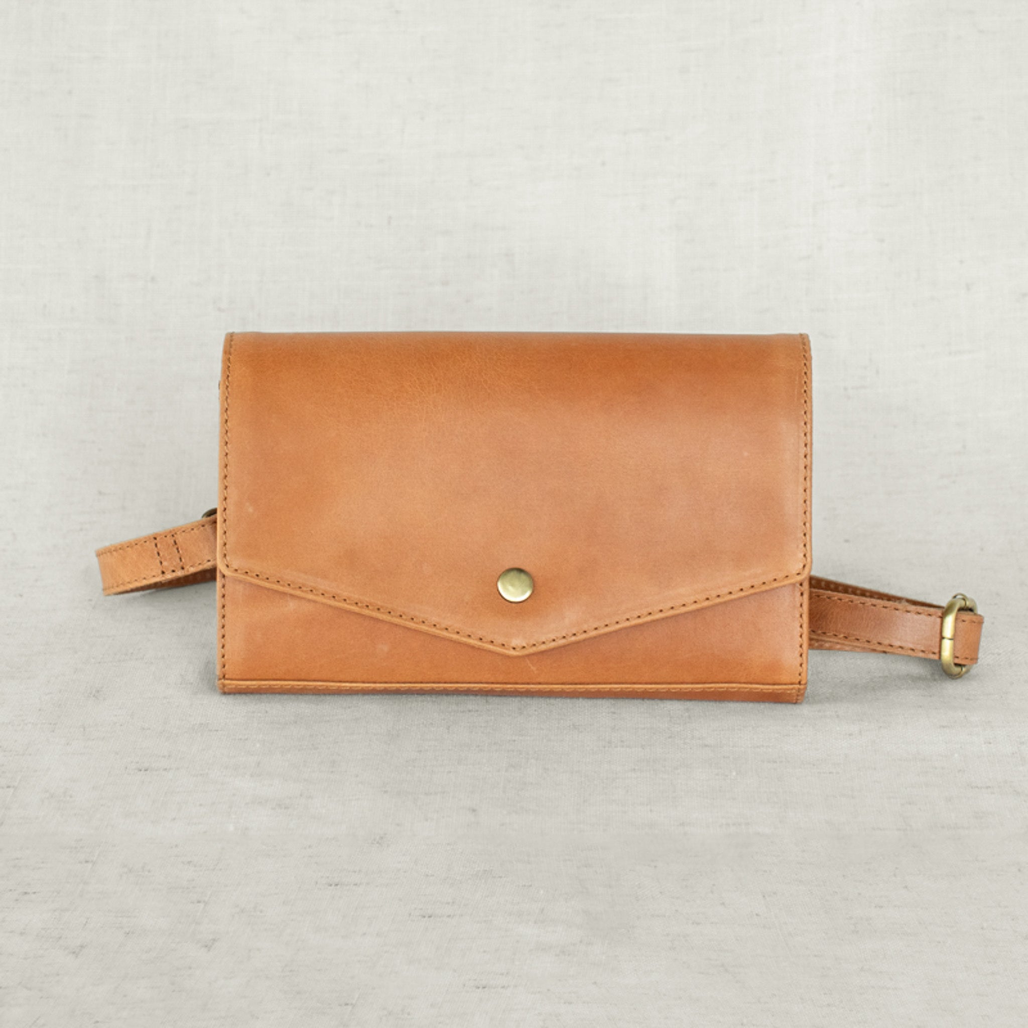 DiMarco Crossbody Bag with Wallet in tan leather, showcasing a stylish and versatile design for everyday organization.