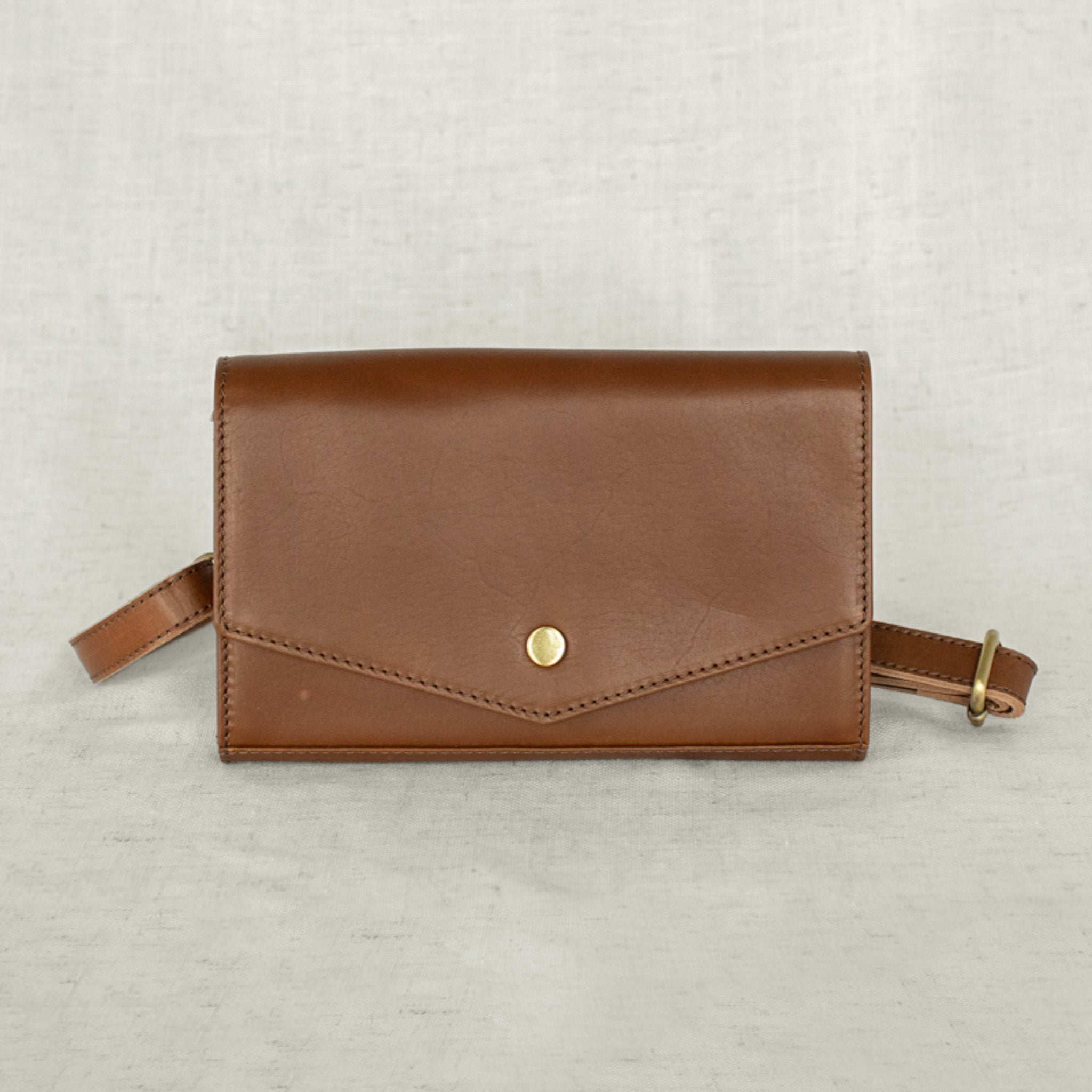 DiMarco Crossbody Bag with Wallet in brown leather, designed for functionality and elegance in casual settings.
