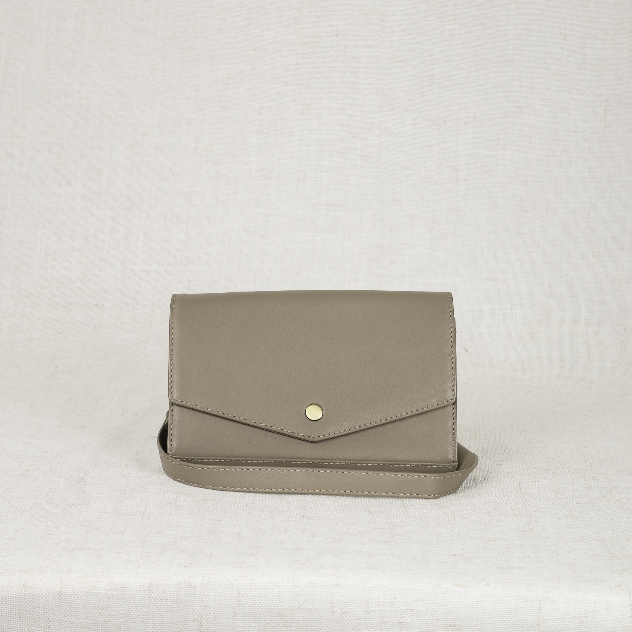 Dimarco crossbody in taupe colored leather front view