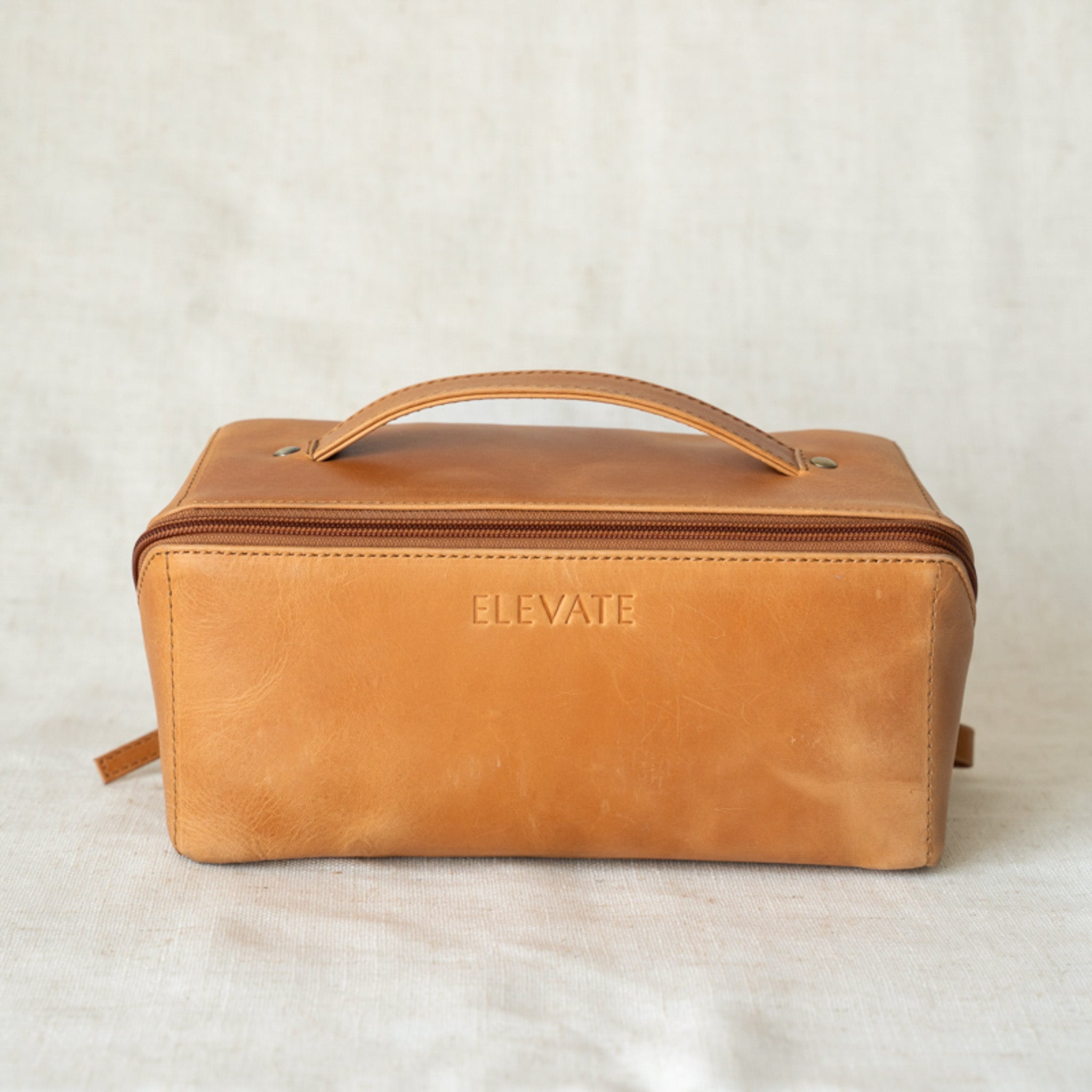Essentials Leather Makeup Bag showing full-grain leather design, ideal for organizing beauty products and toiletries.