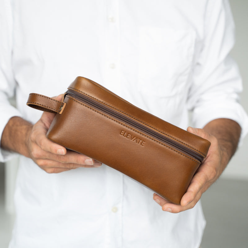 Interior view of the full-grain leather dopp kit displaying its spacious design ideal for travel.