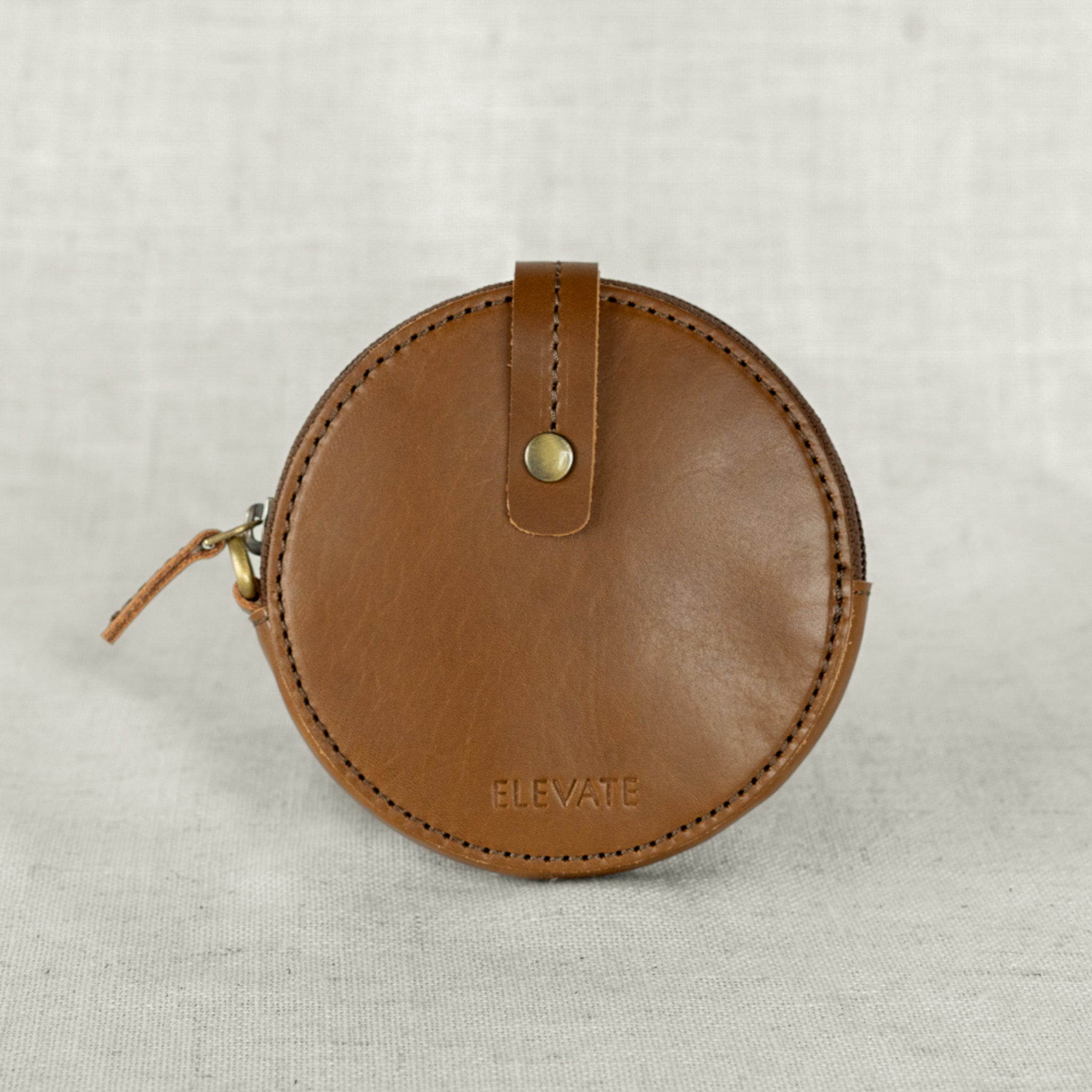 Leather coin purse in a casual setting, perfect for travel and running errands.