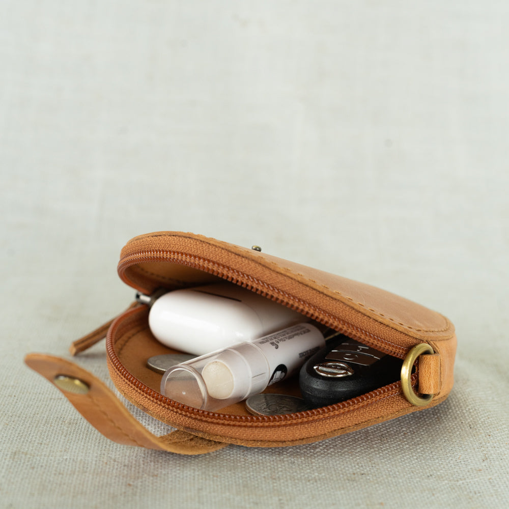 Leather coin purse displayed as a 3-in-1 accessory featuring a convertible belt bag design.