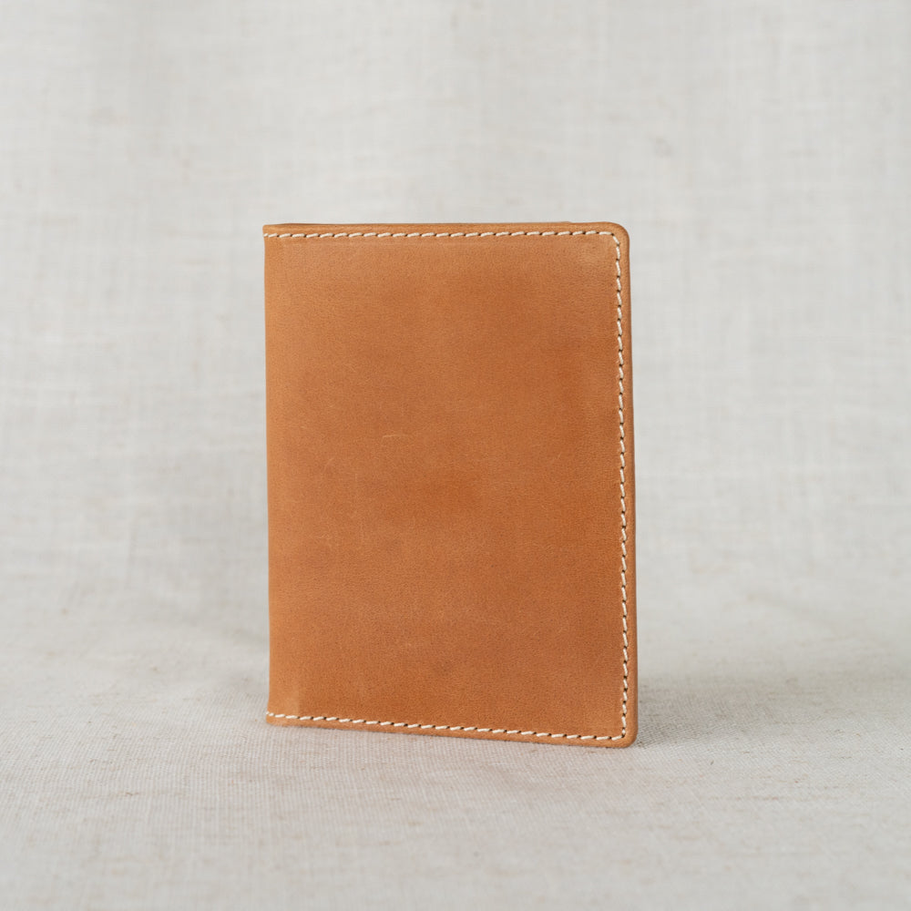 Elegant Leather Passport Wallet open, displaying space for passport, cash, and boarding passes.