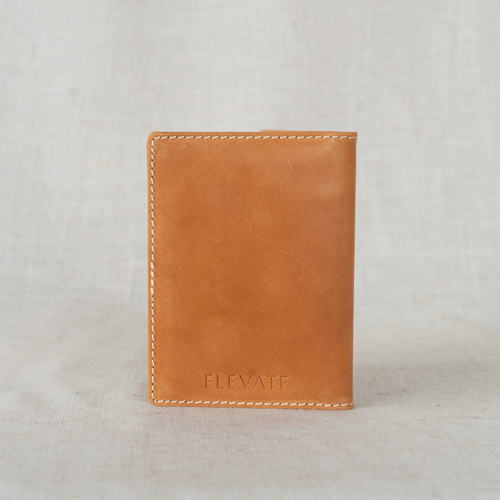 Leather Passport Wallet in hand, demonstrating its lightweight design and functionality for frequent travelers.