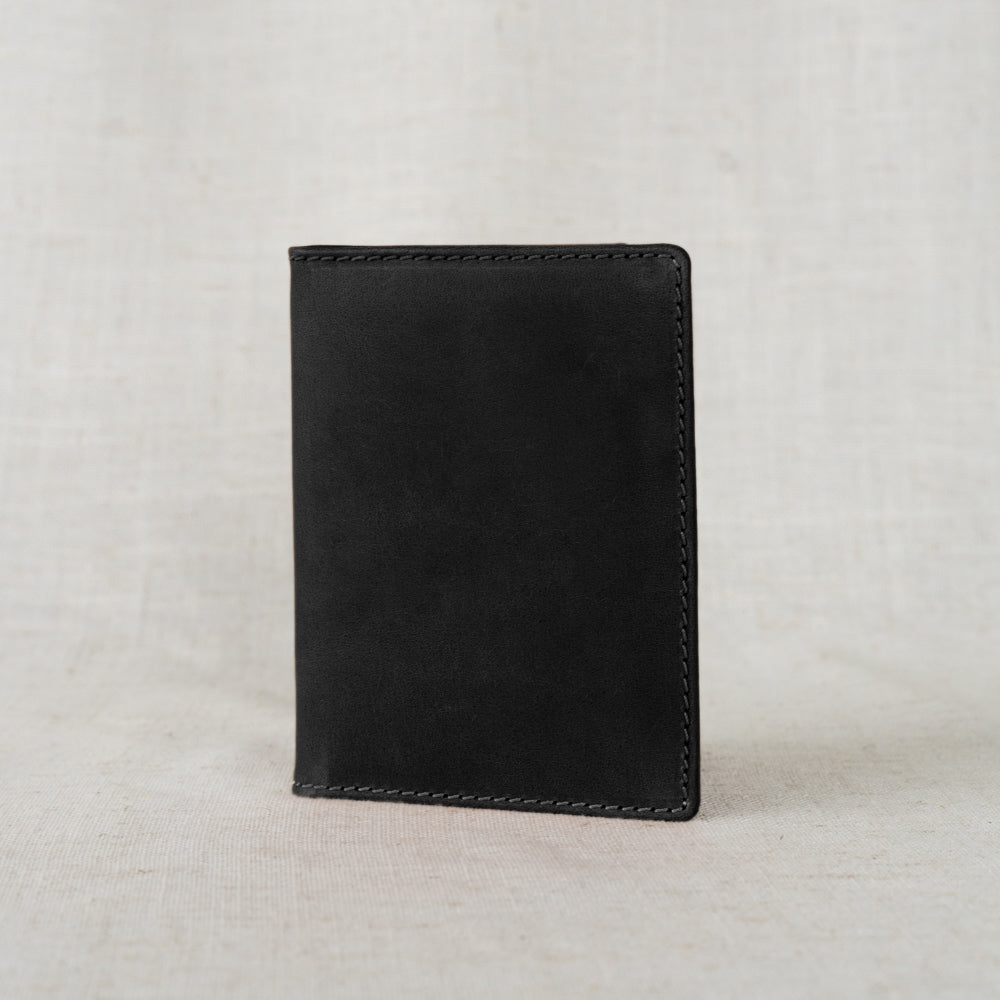 Leather Passport Wallet featuring two inside pockets to keep your travel items securely organized.
