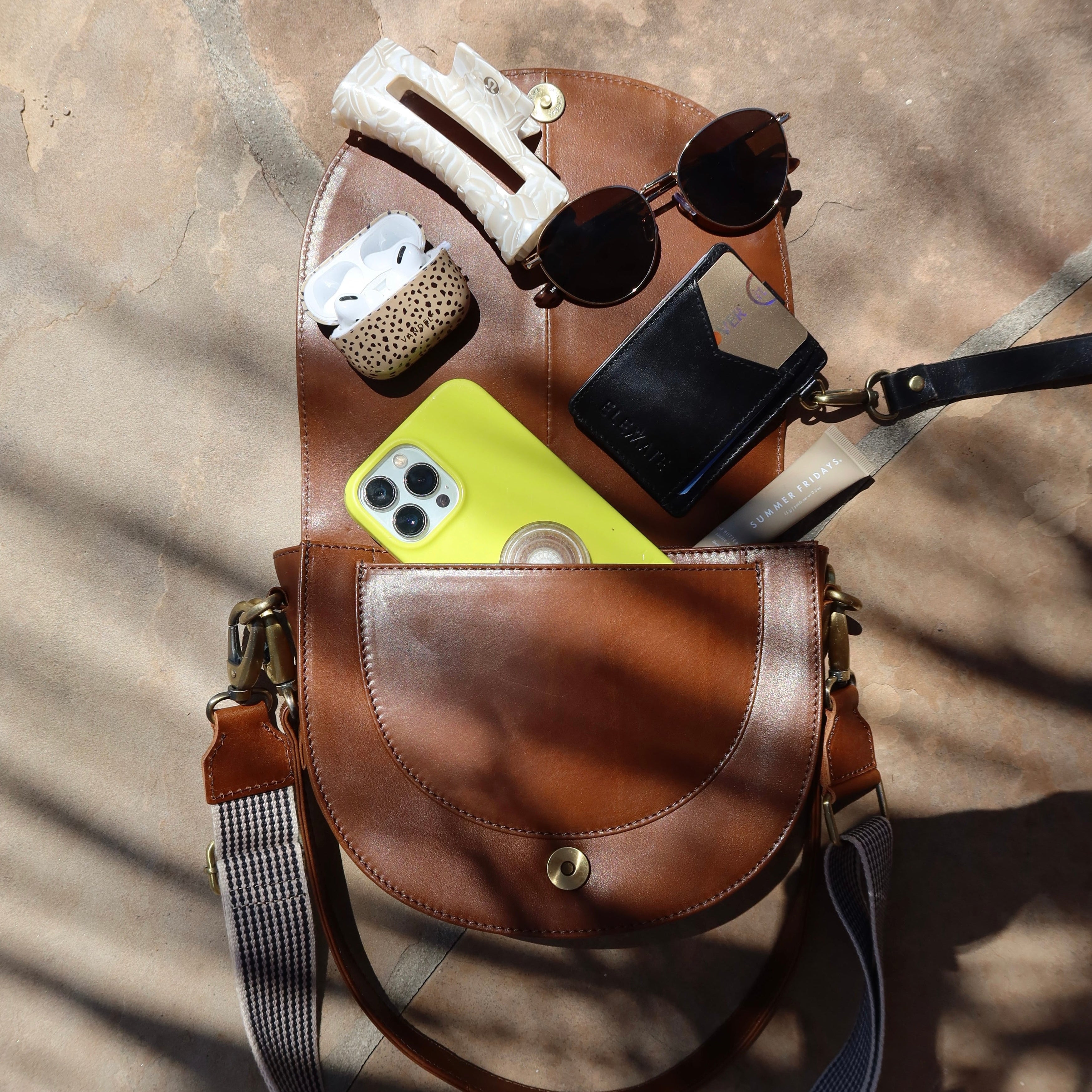 Interior view of the Stella Saddle Bag highlighting the roomy space and zip pocket for secure storage.