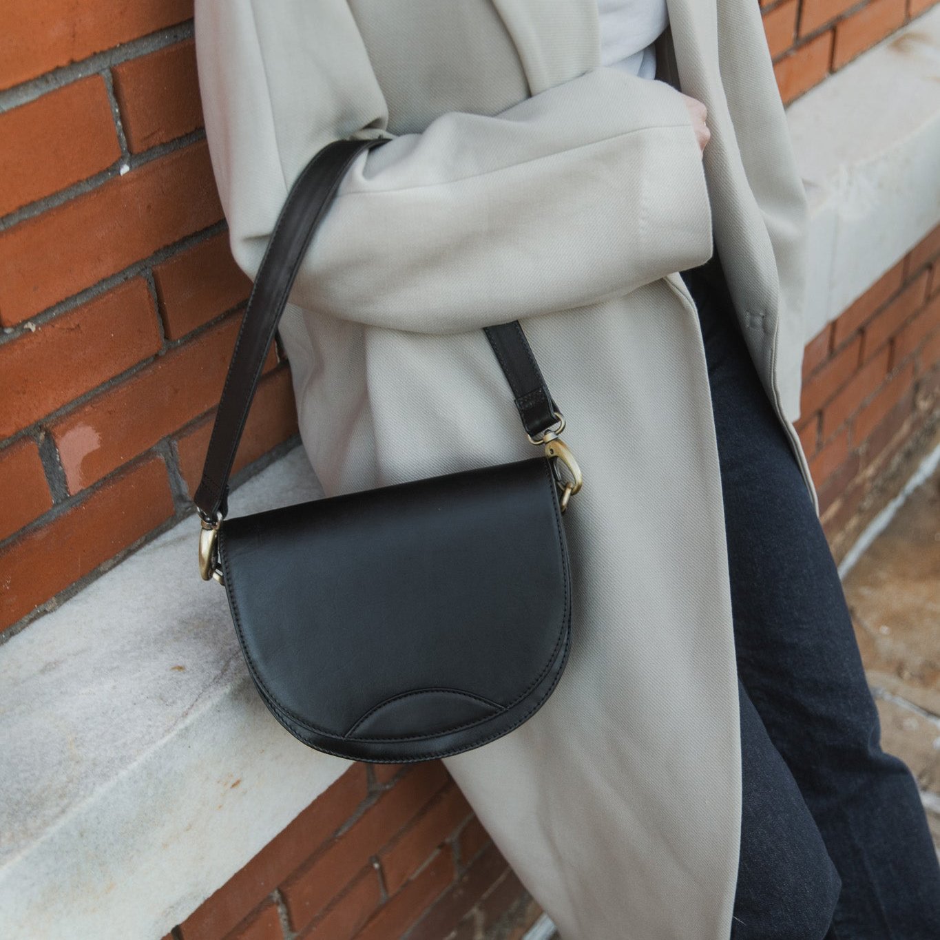 Unique styling of the Stella Saddle Bag, a functional and fashionable leather saddle bag.
