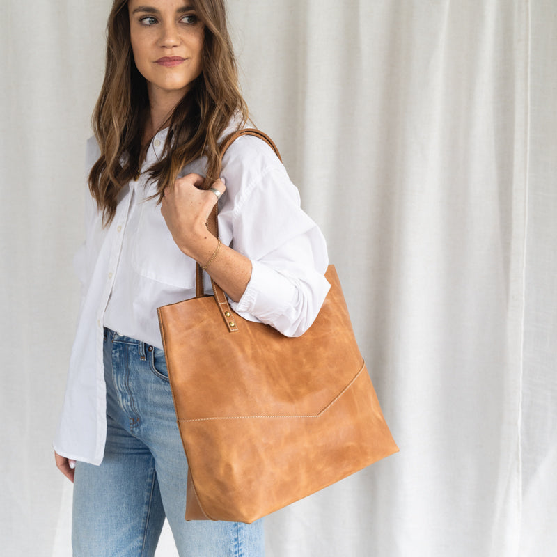 Traveler's Tote in use, demonstrating its versatility as a leather tote bag for women for work and errands.