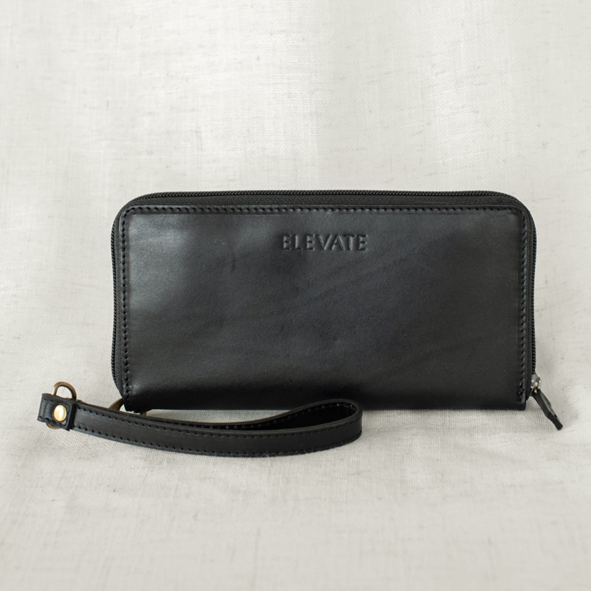 Detachable wristlet feature of the leather zipper wallet for convenience when on the go.