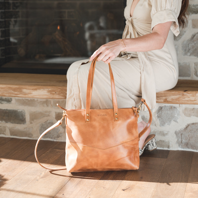 The timeless craftsmanship of the Mid-sized Zipper Tote, a chic leather zipper tote that ages beautifully.