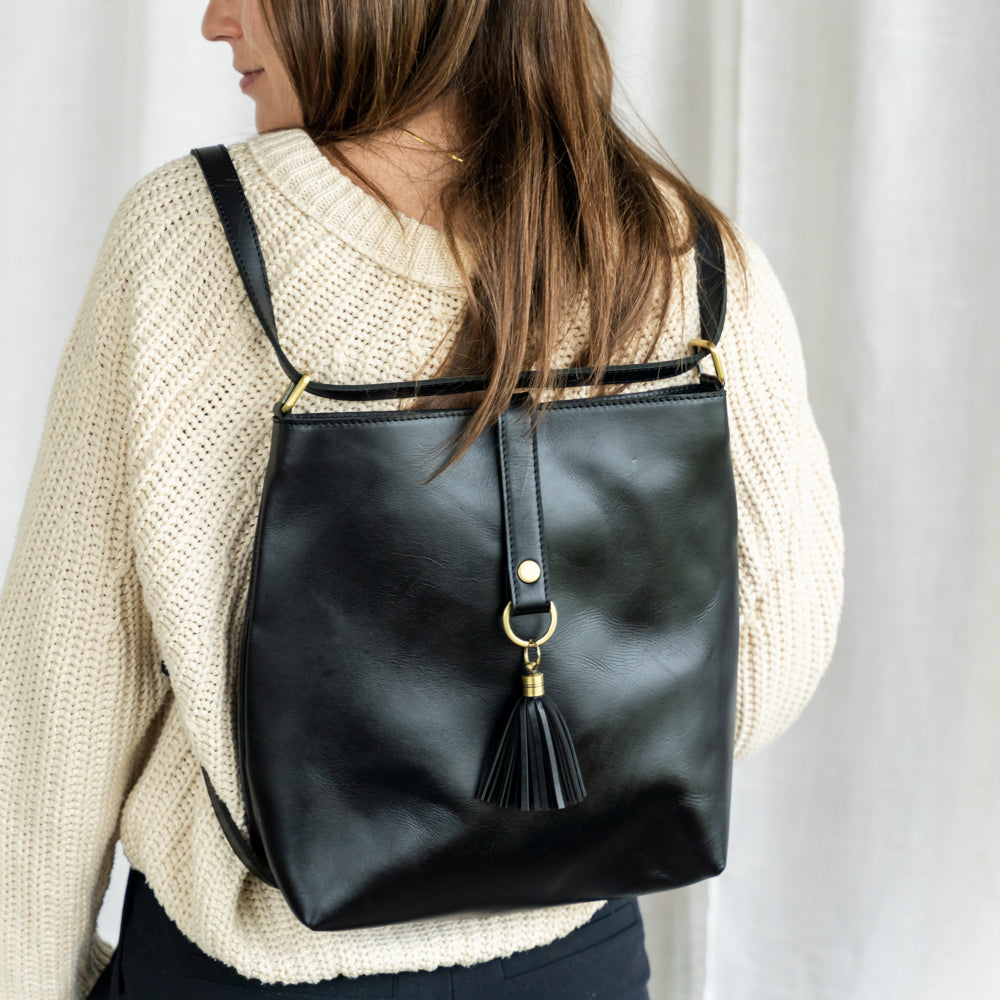 Elevate Mini Slingback Bag in a natural setting, perfect for adventurers, emphasizing its dual functionality as a mini slingback bag.