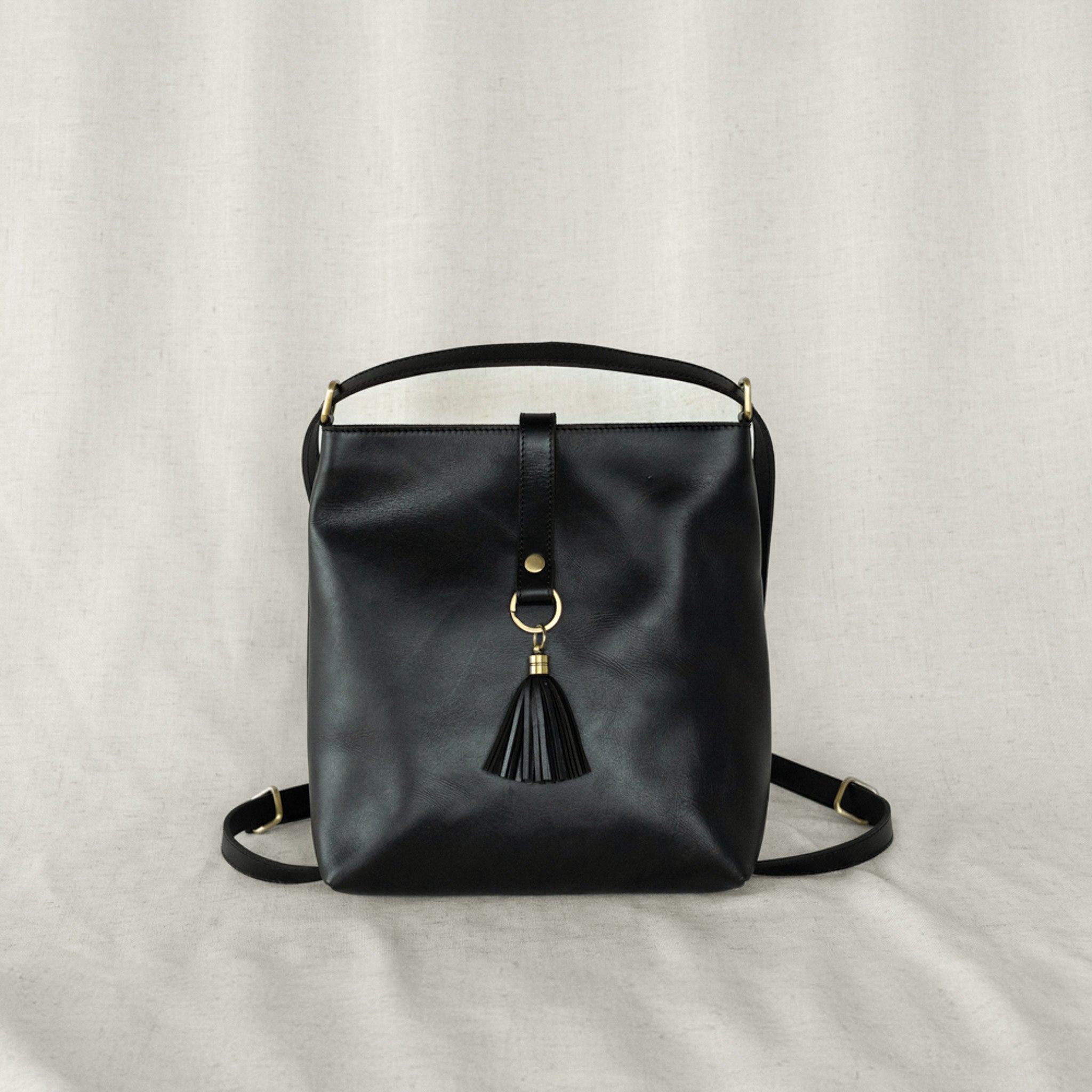 Elevate Mini Slingback Bag displayed in backpack mode, emphasizing its transformable design as a chic mini slingback bag.
