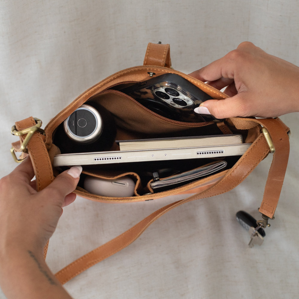 Elevate Mini Slingback Bag worn stylishly by a model, showcasing its versatility as a mini slingback bag for various outfits.