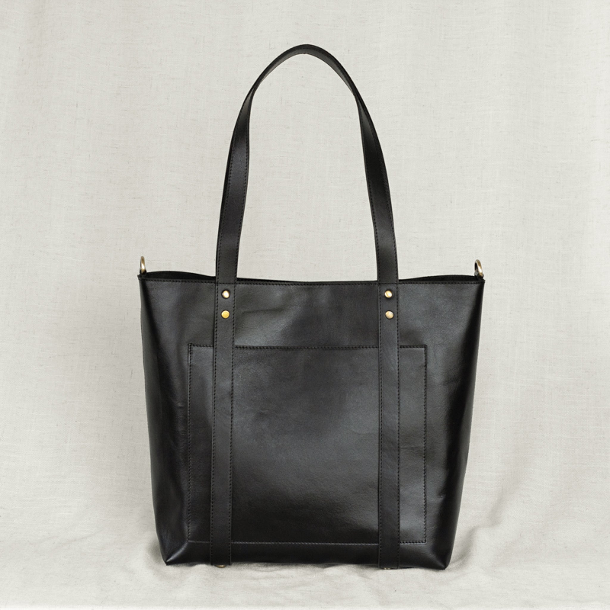 Leather Travel Hat Tote in a chic setting - A perfect accessory for stylish travelers, showcasing roomy interior.