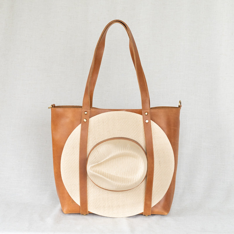 Chic Leather Travel Hat Tote showing spacious interior, perfect for storing hats and travel essentials.