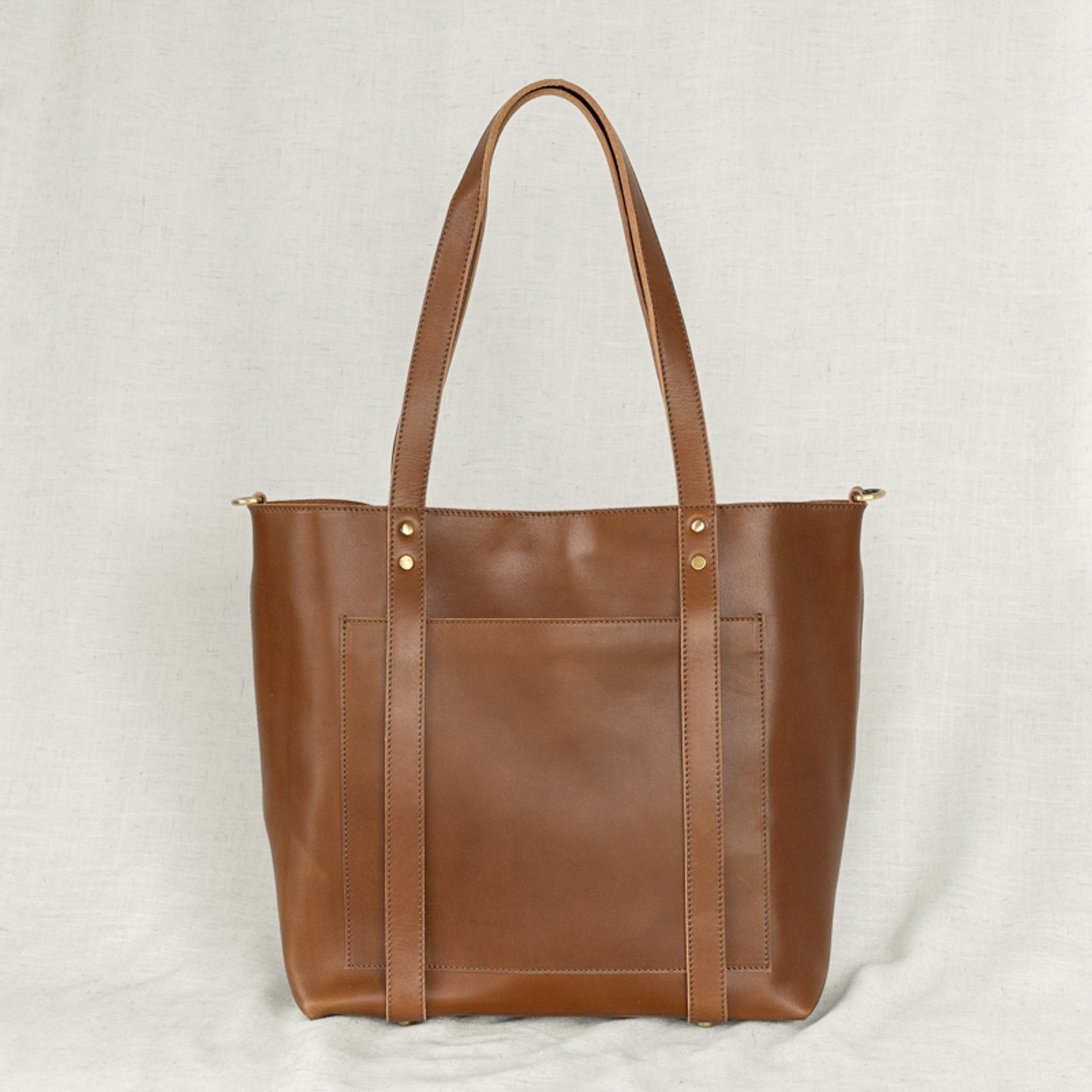 Elegant Leather Travel Hat Tote - Features outside pocket for essentials, merging style with functionality.