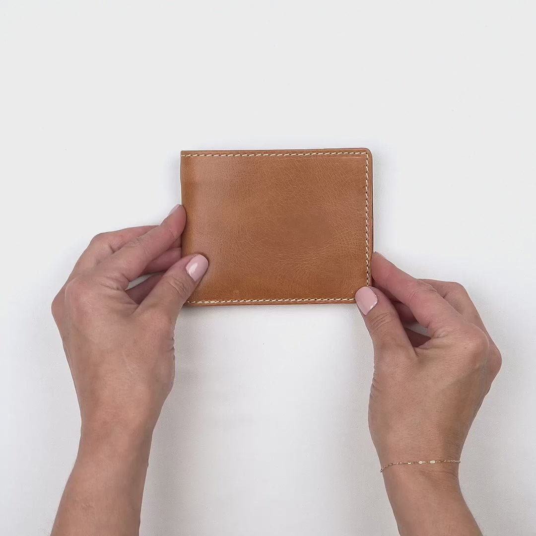 video showing the classic bi fold wallet on a white background