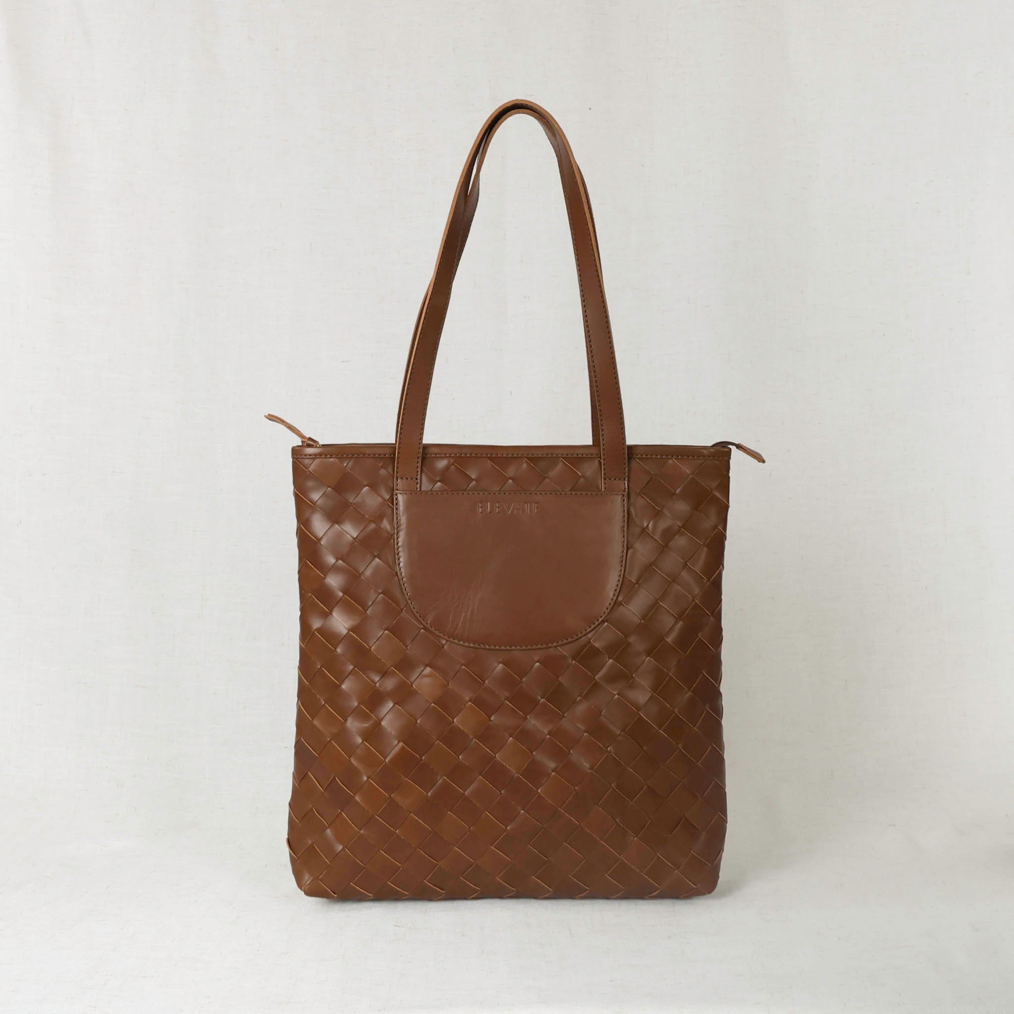 Shirin Woven Leather Tote showcasing its handcrafted vertical design, perfect for elegance and functionality as a woven leather tote.