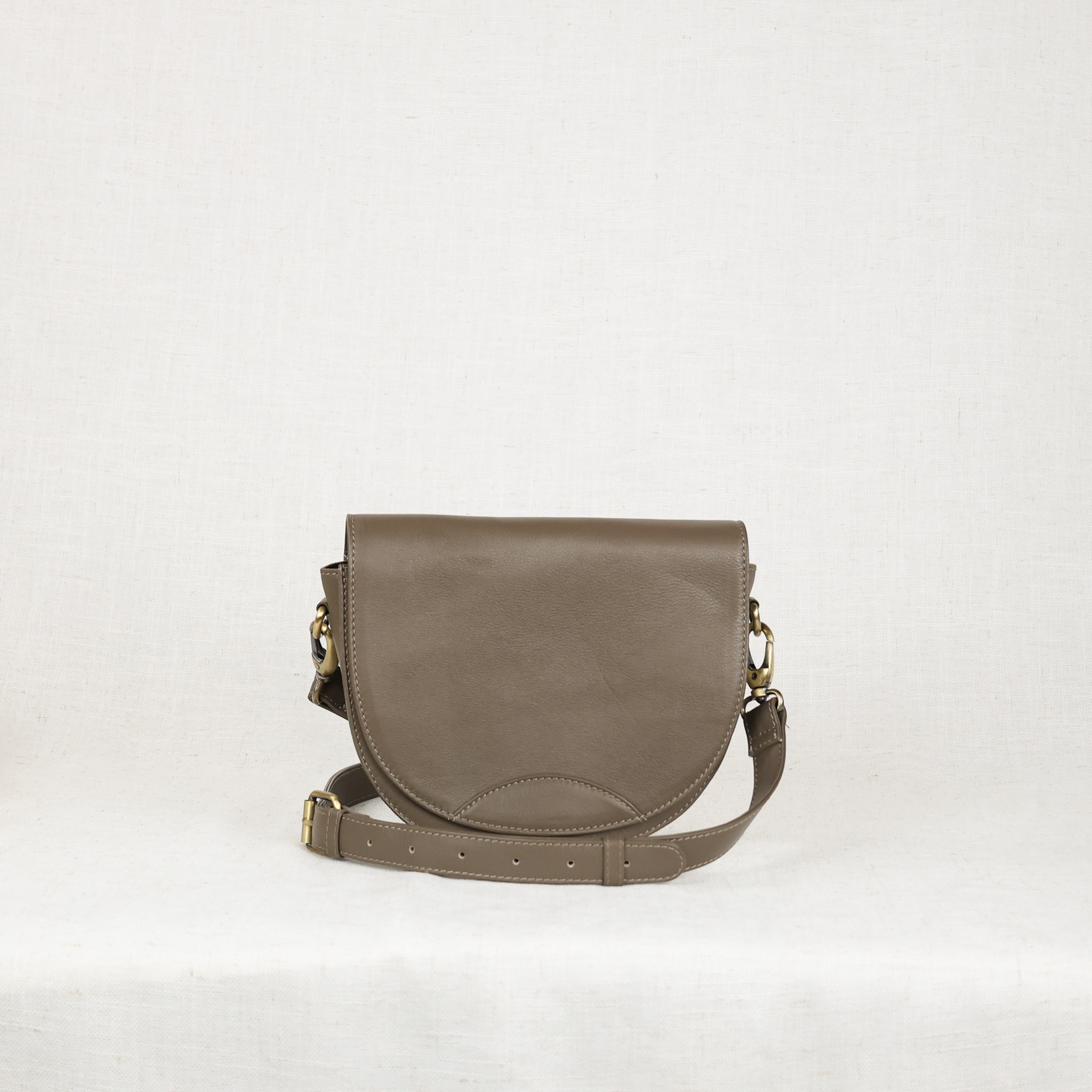 Stylish Stella Leather Saddle Bag made of premium full-grain leather, showcasing its luxurious design and spacious interior.