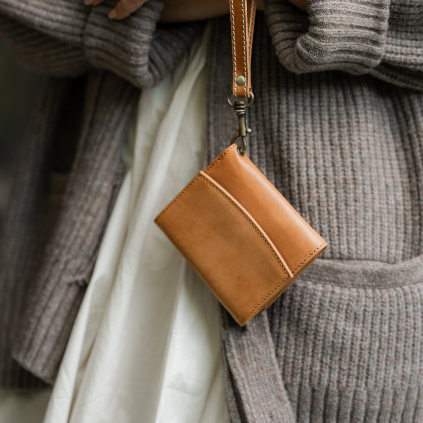 Flat lay of the Suri Wallet showing its compartments and design details, ideal for women who want a functional leather wallet.