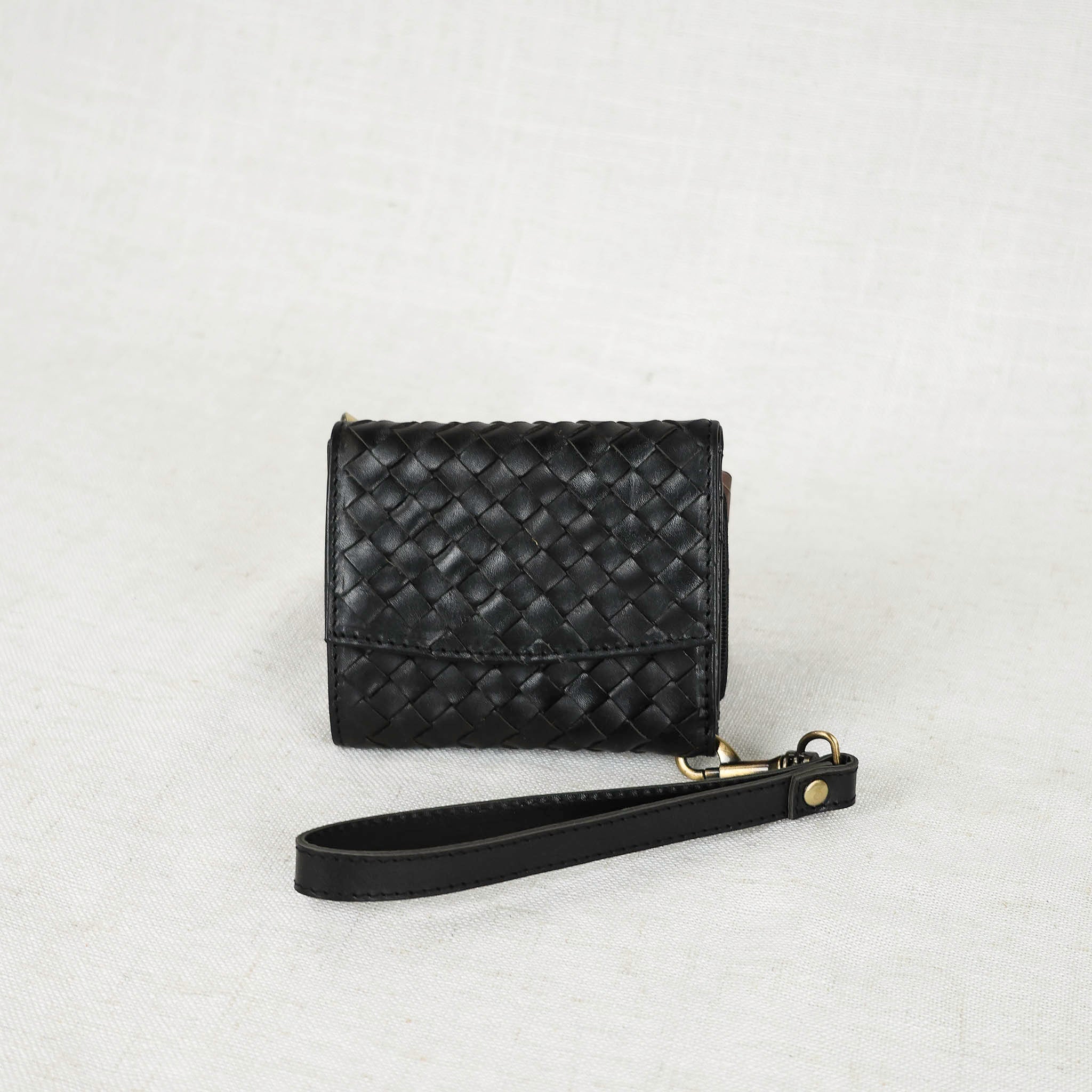 Suri Woven Leather Wallet showcasing its stylish design and premium quality materials, perfect for everyday use as a woven leather wallet.