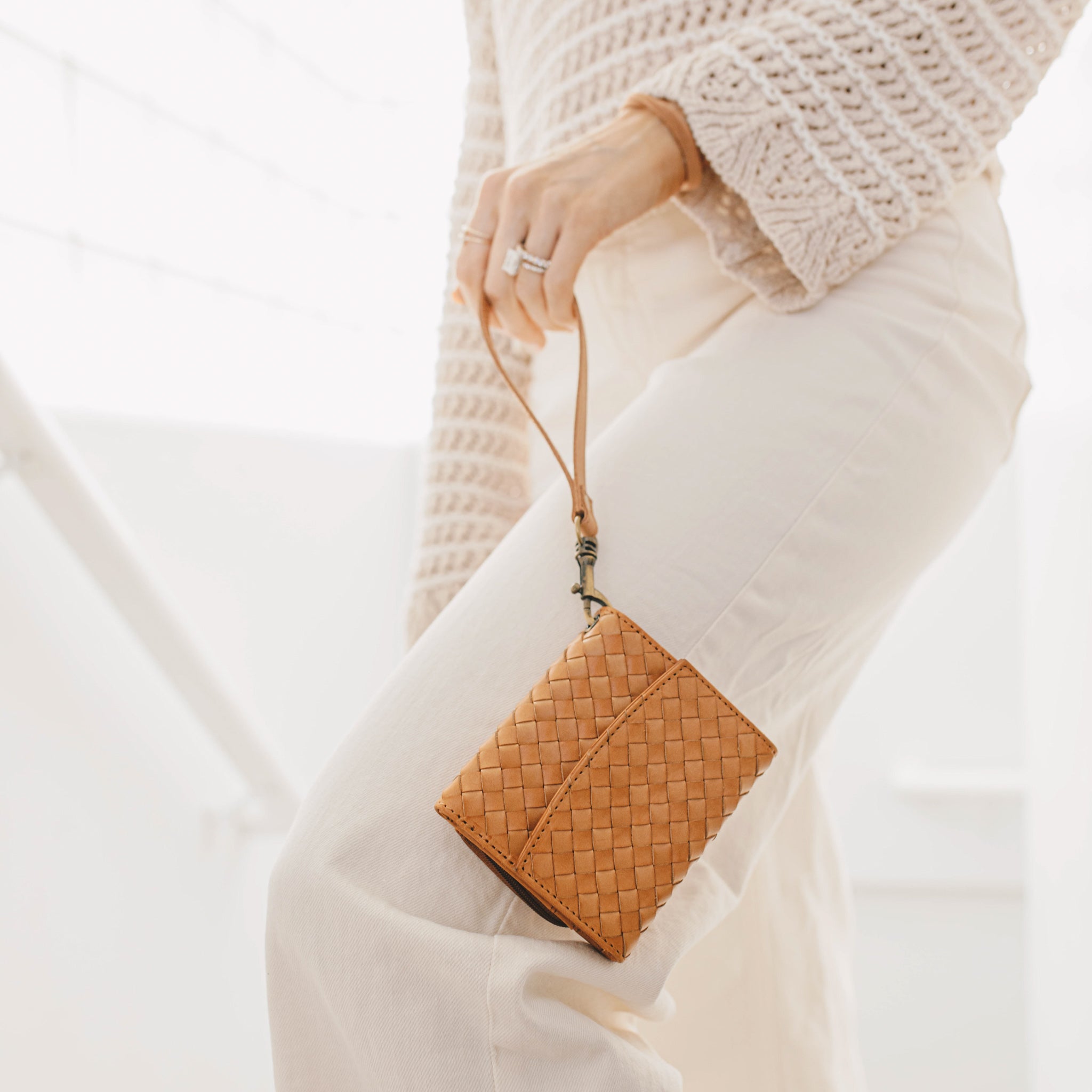 The functional interior of the Suri Woven Leather Wallet showing card slots and a zippered coin pocket.