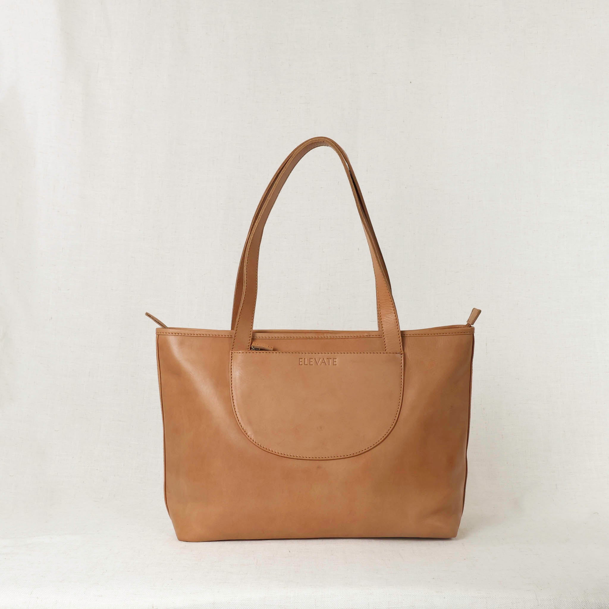 Tara Tote - Premium Leather Tote With Laptop Sleeve showcasing its elegant design and rich color.