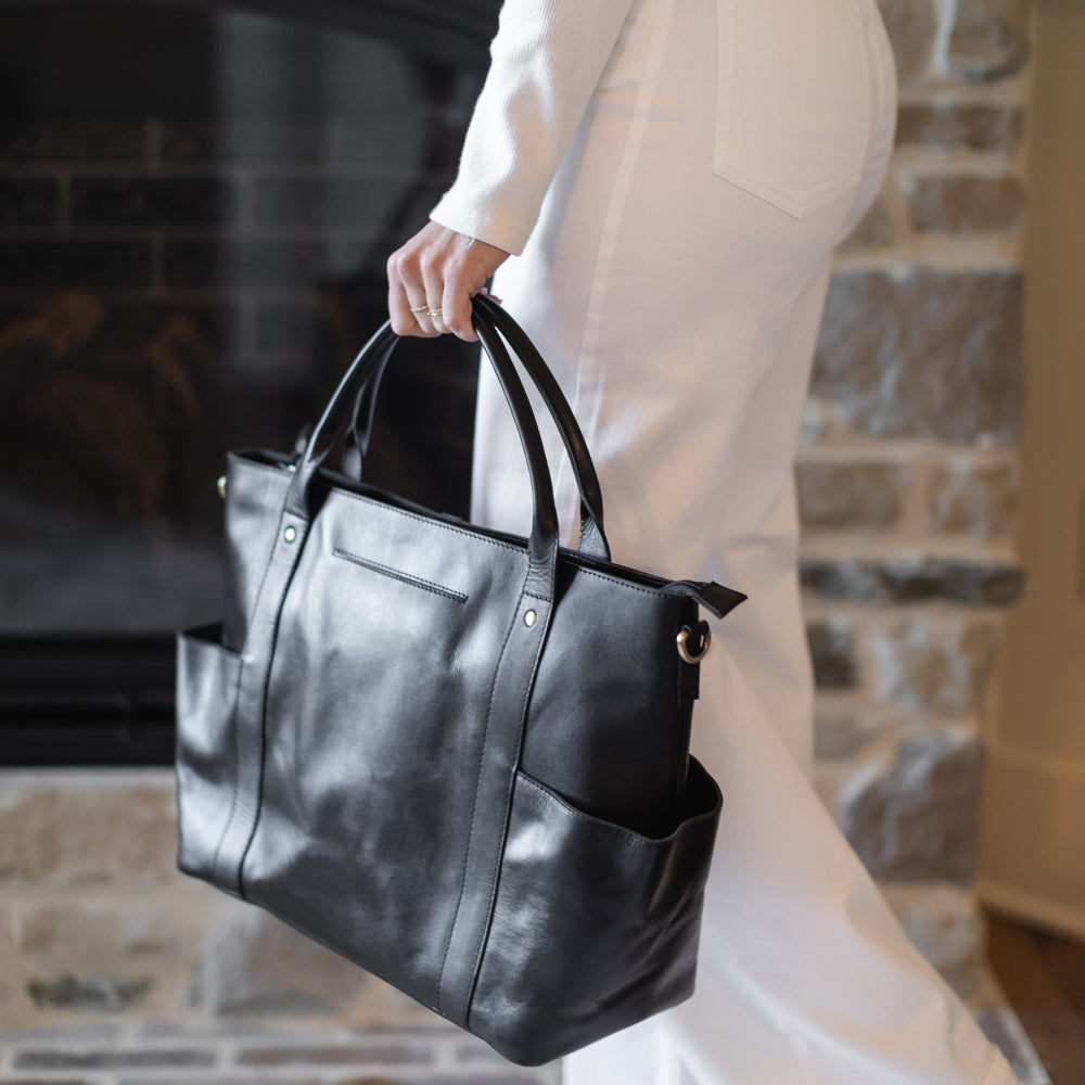 Woman holding Utility Tote by Elevate in black