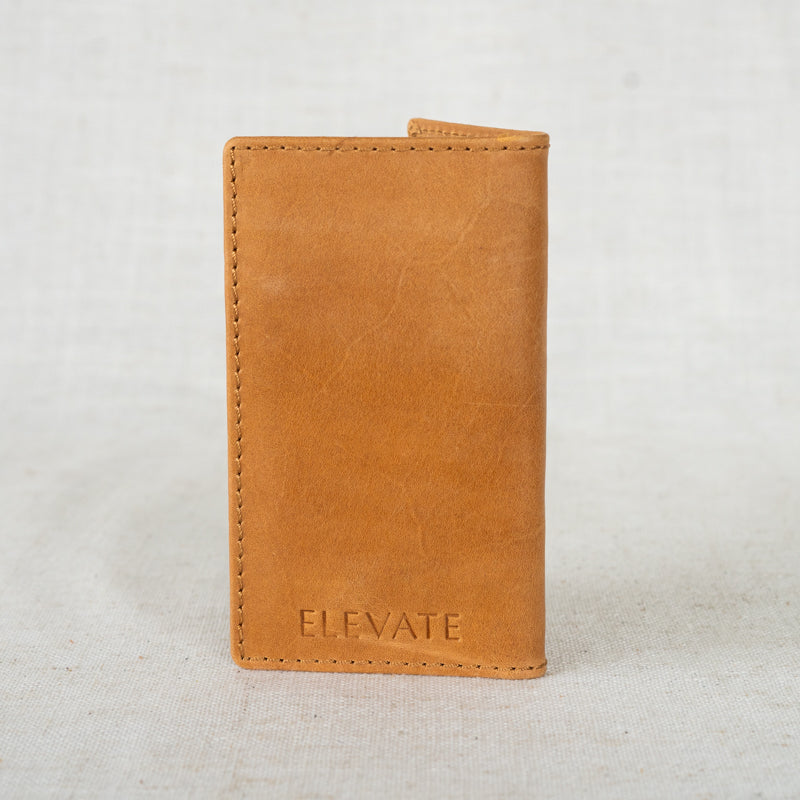Elegant Vertical Leather Card Wallet displayed on a rustic background, highlighting its craftsmanship.