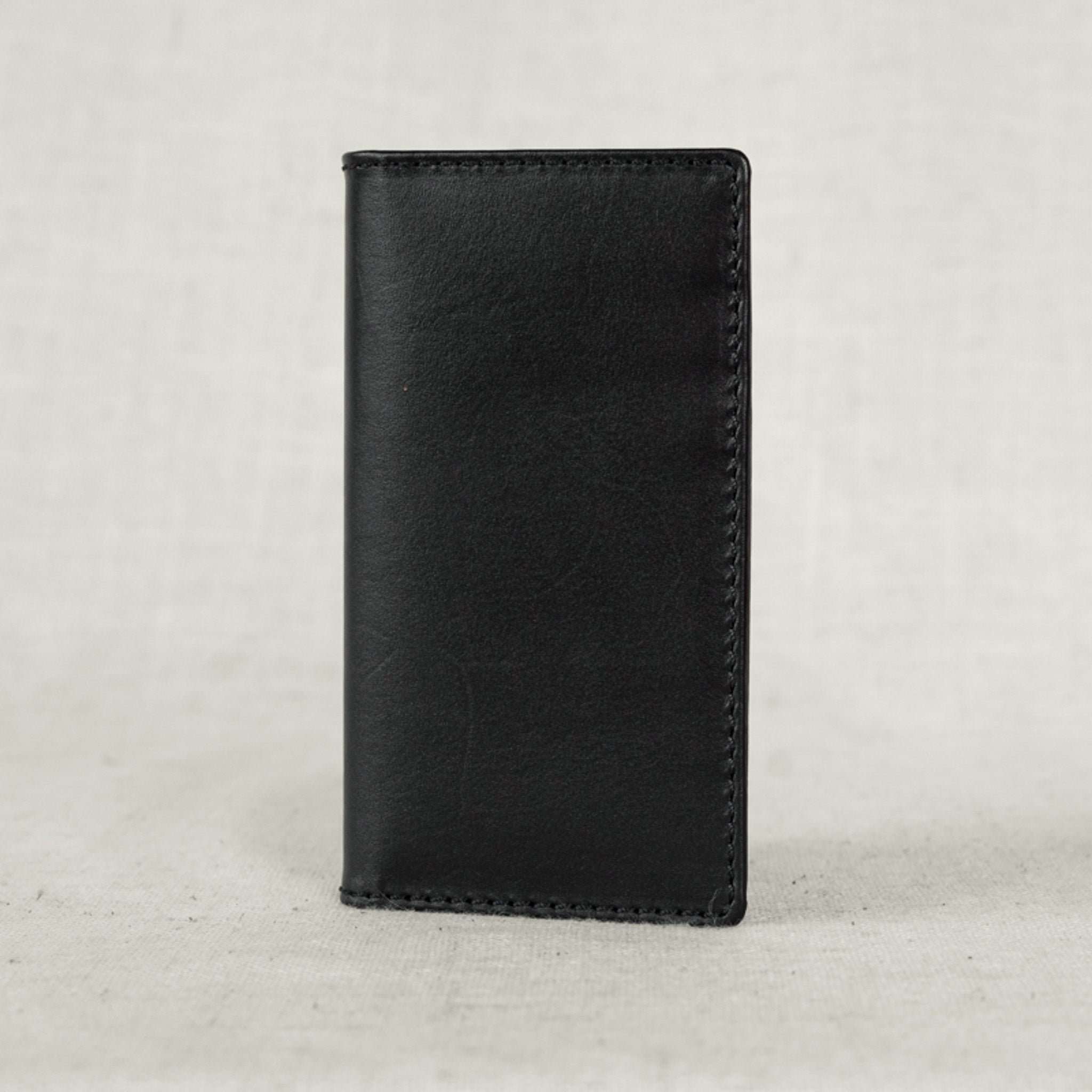 Close-up of the Vertical Leather Card Wallet, emphasizing its durable full-grain leather texture.