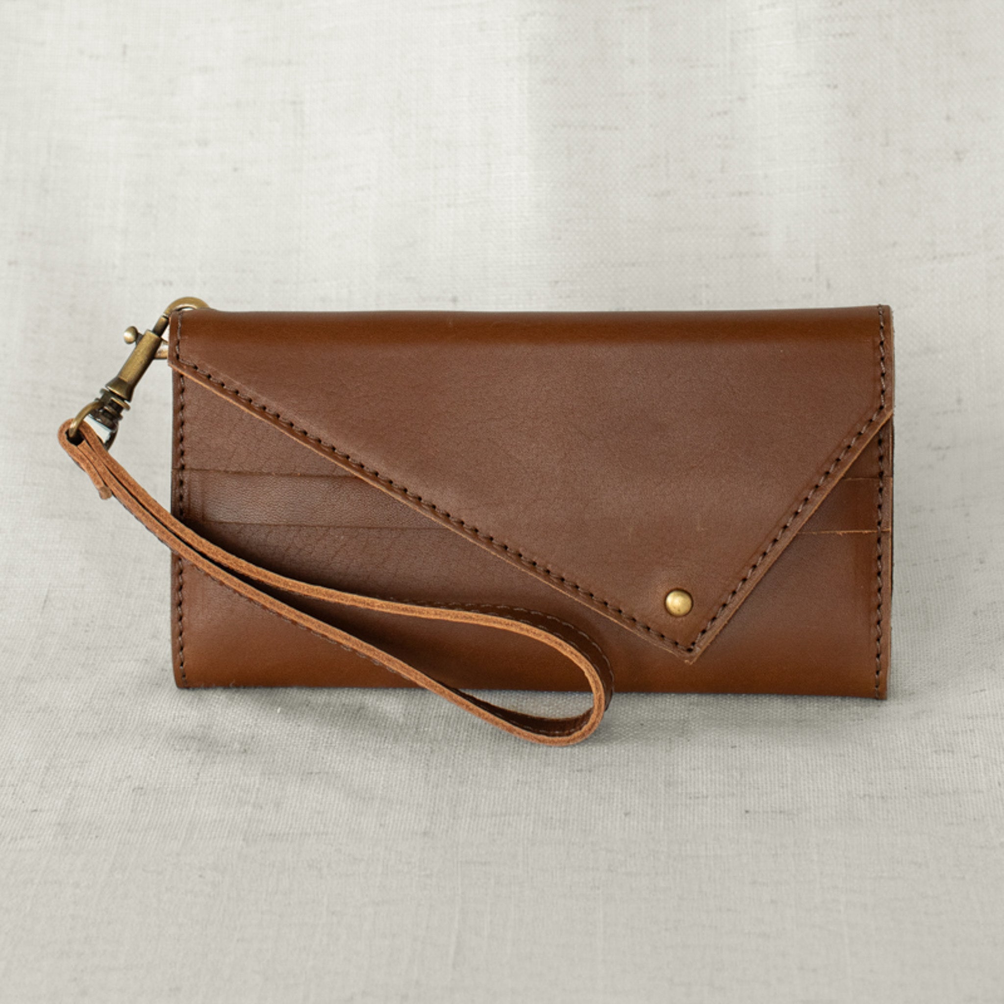 Tri-fold Wallet in use, showcasing its functionality and design versatility as a women's leather wallet.