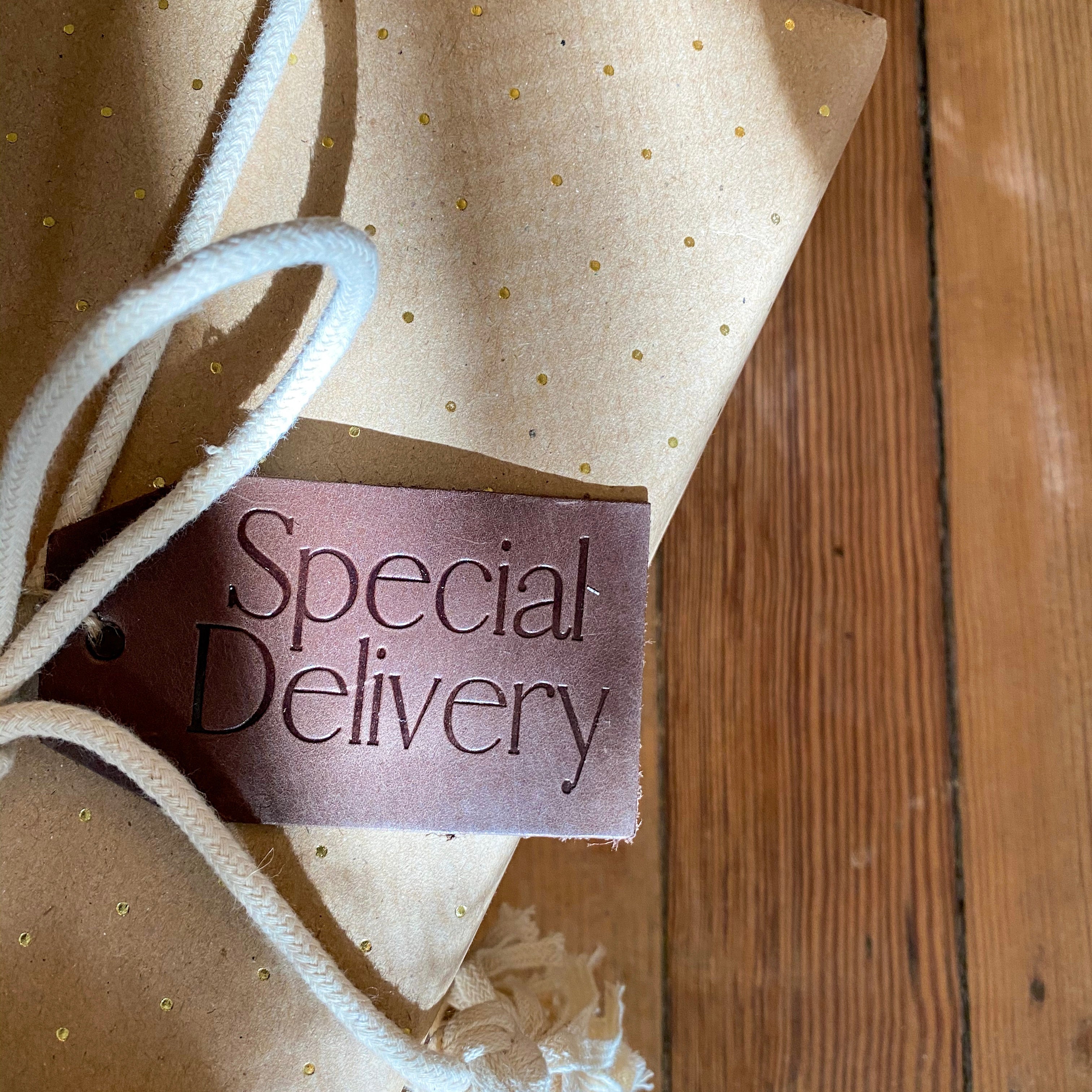 Leather Gift Tags arranged with Christmas decorations, highlighting their versatility for holiday gifting and décor.