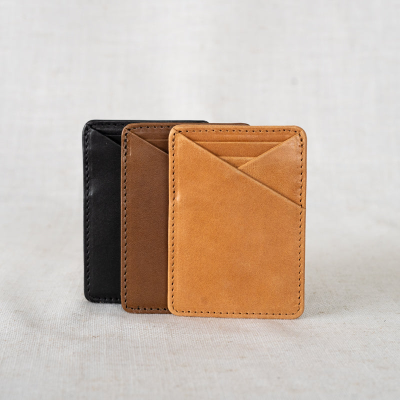 Money Clip Wallet by Elevate on linen in black, chestnut and camel