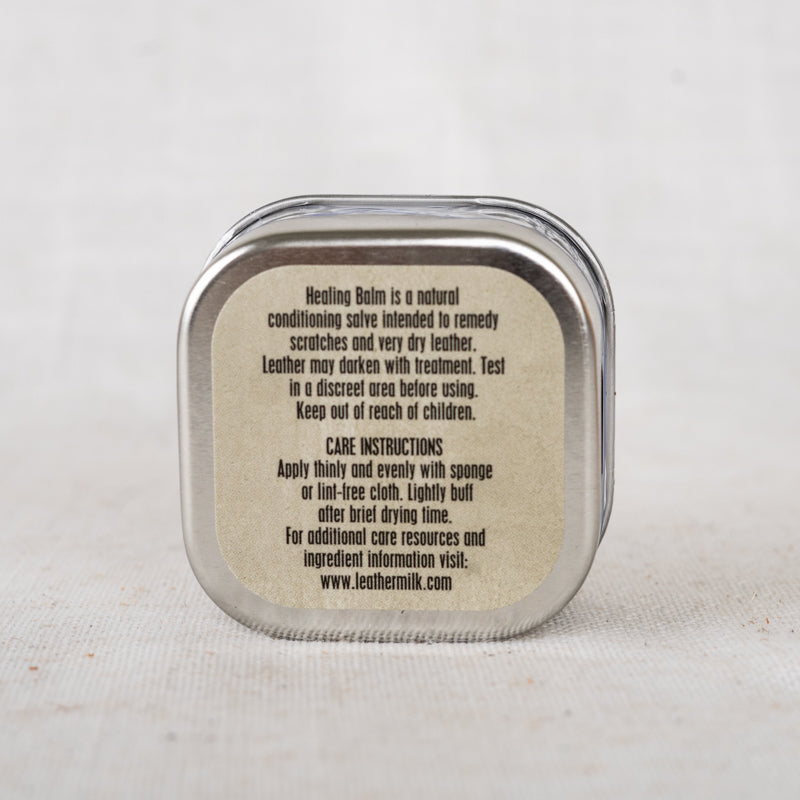 Application of Chamberlain's Leather Healing Balm on leather shoes, showcasing its effectiveness in restoring and moisturizing leather.
