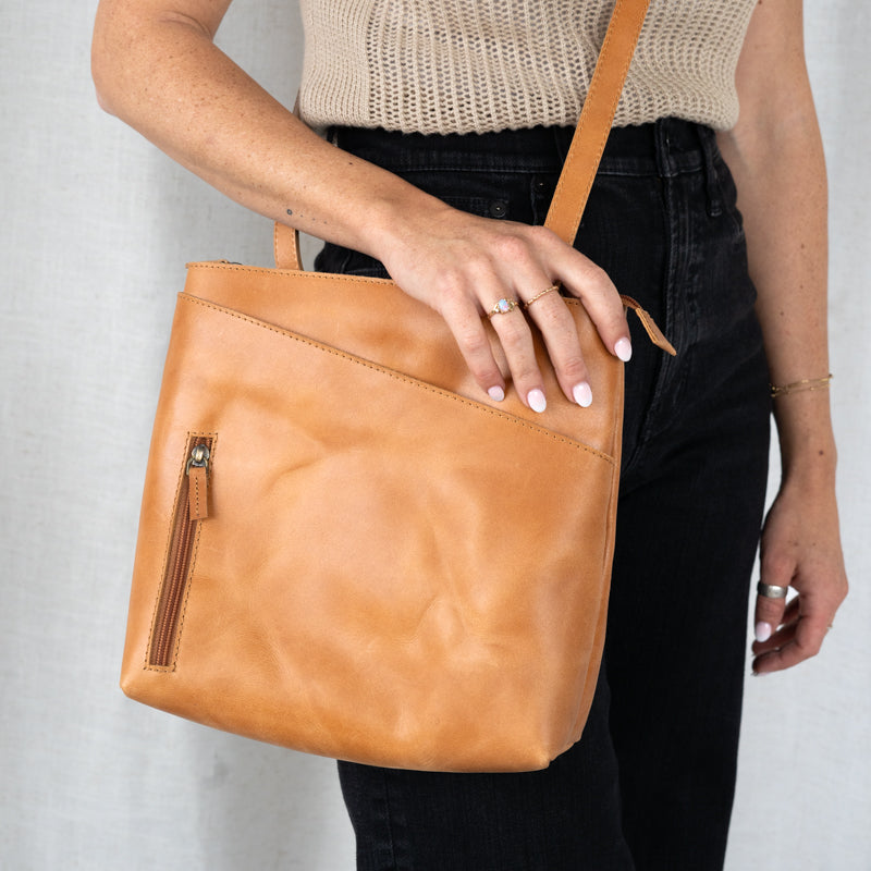 Minimalist design of The Sojourner - 2-in-1 Backpack & Crossbody, the perfect convertible leather backpack for travel.