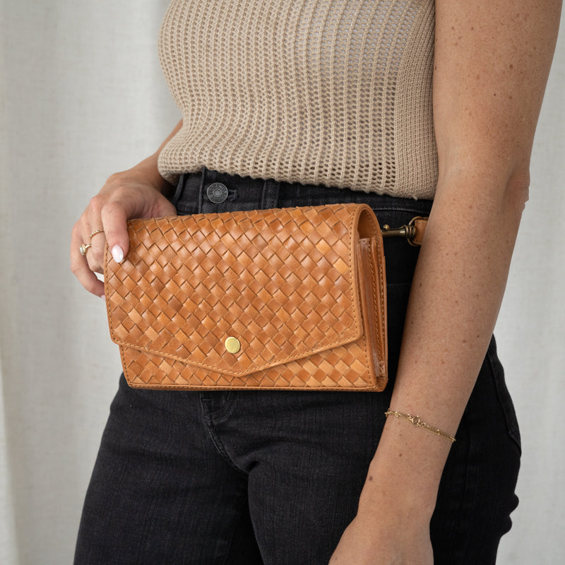 Woman wearing Woven DiMarco by Elevate as a belt bag