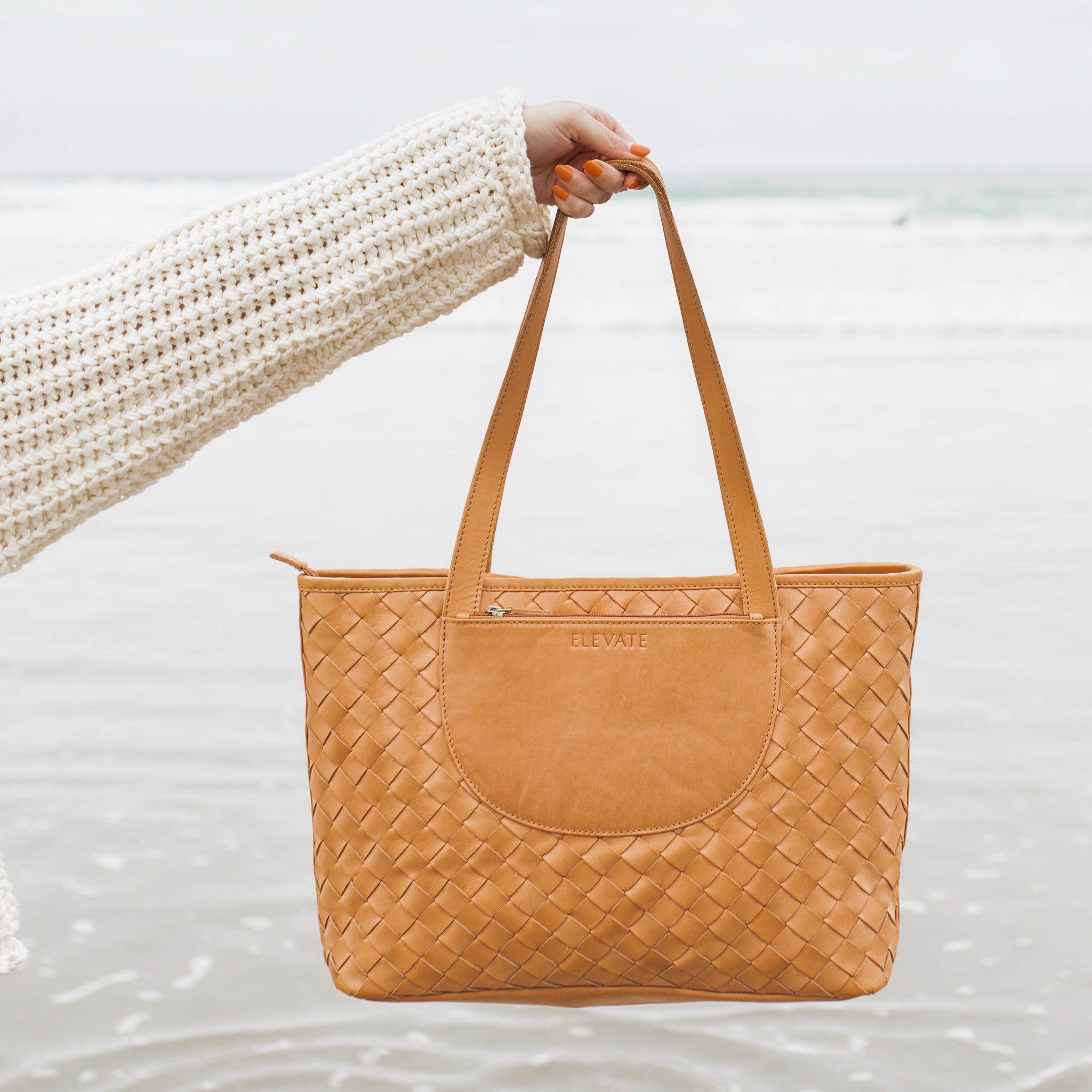 Stylish fashion shot of the Tara Tote, a beautiful hand woven leather tote ideal for commuting.