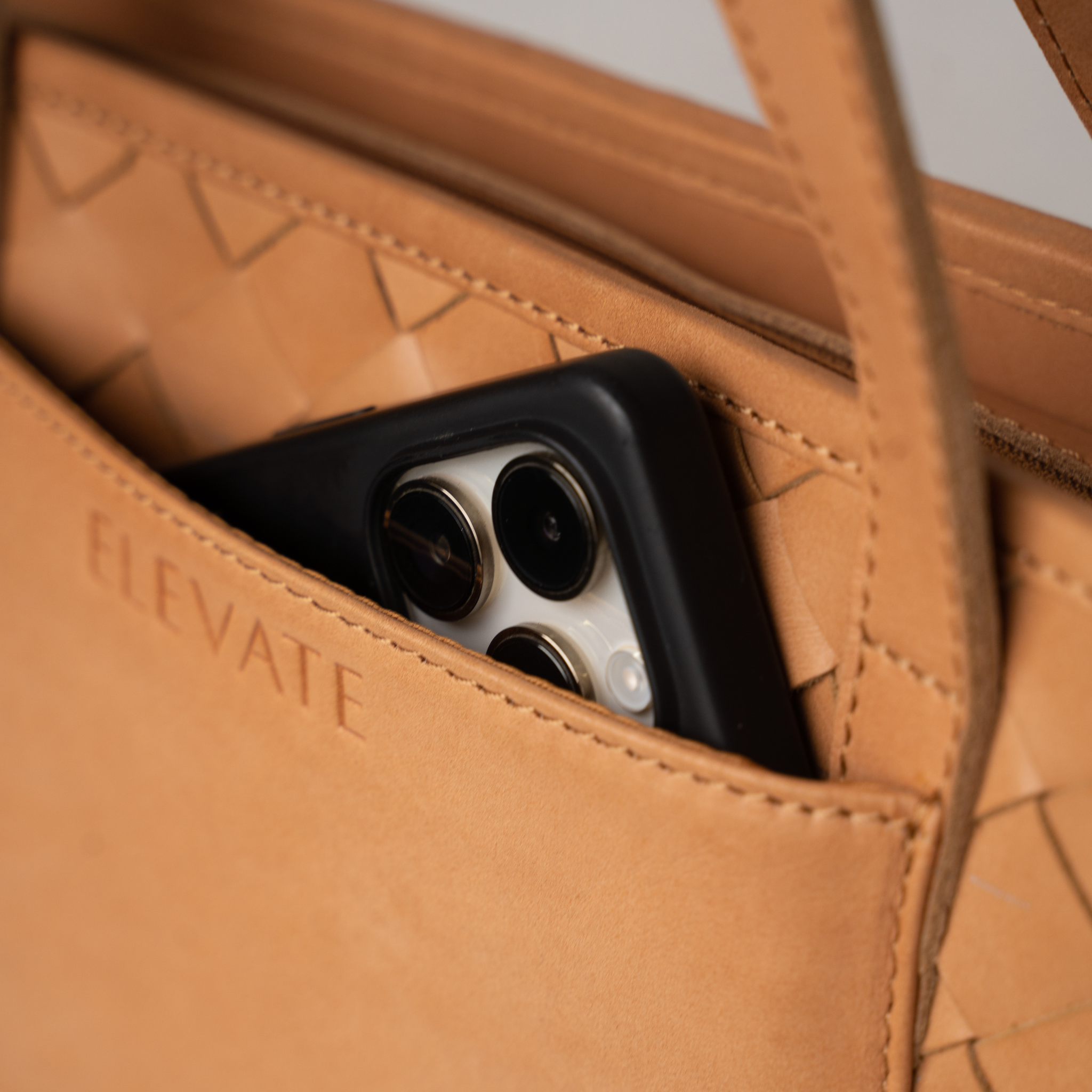 Tara Tote's premium leather texture, showcasing craftsmanship in this exquisite hand woven leather tote.