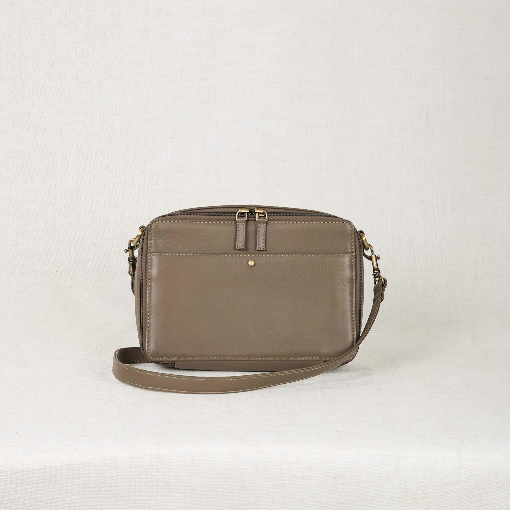 Stylish Nomad Crossbody Bag - A vintage inspired leather bag with accordion-style interior for efficient organization.