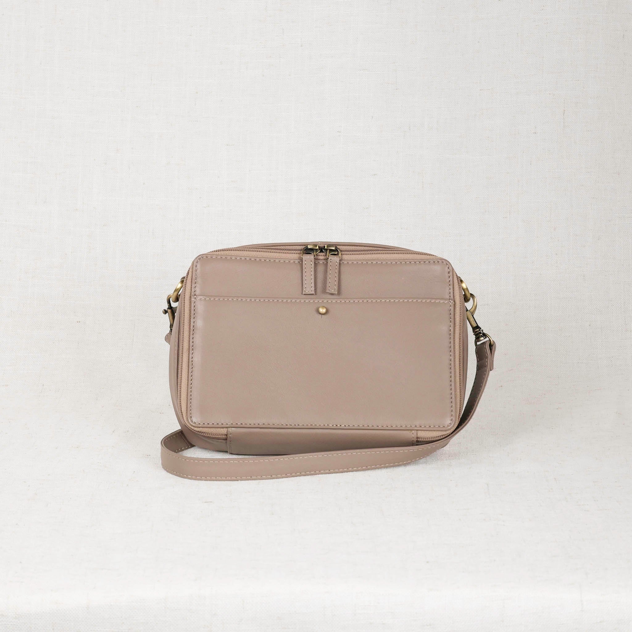 Nomad Crossbody Bag - A vintage inspired leather bag showcasing its elegant design and superior craftsmanship.