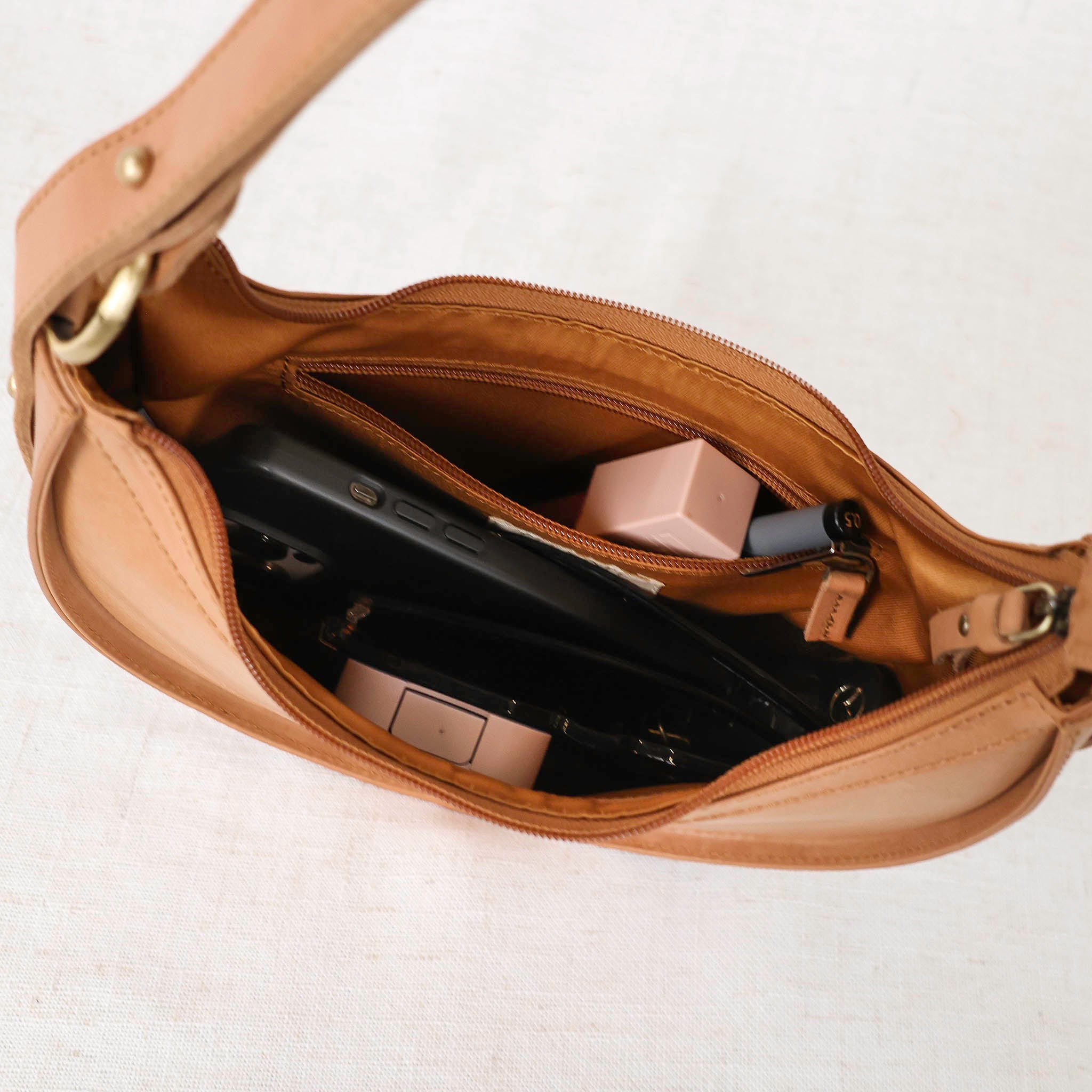 Versatile Priya Crossbody 3-in-1 Leather Crossbody Bag worn casually for a day out.