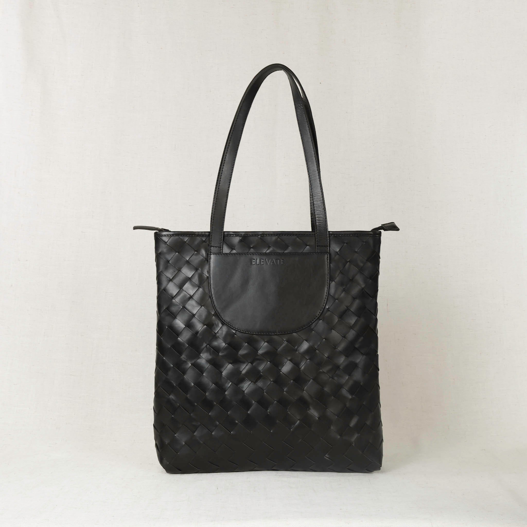 Interior view of the Shirin Woven Leather Tote, illustrating smart organization features and spacious design ideal for everyday use.