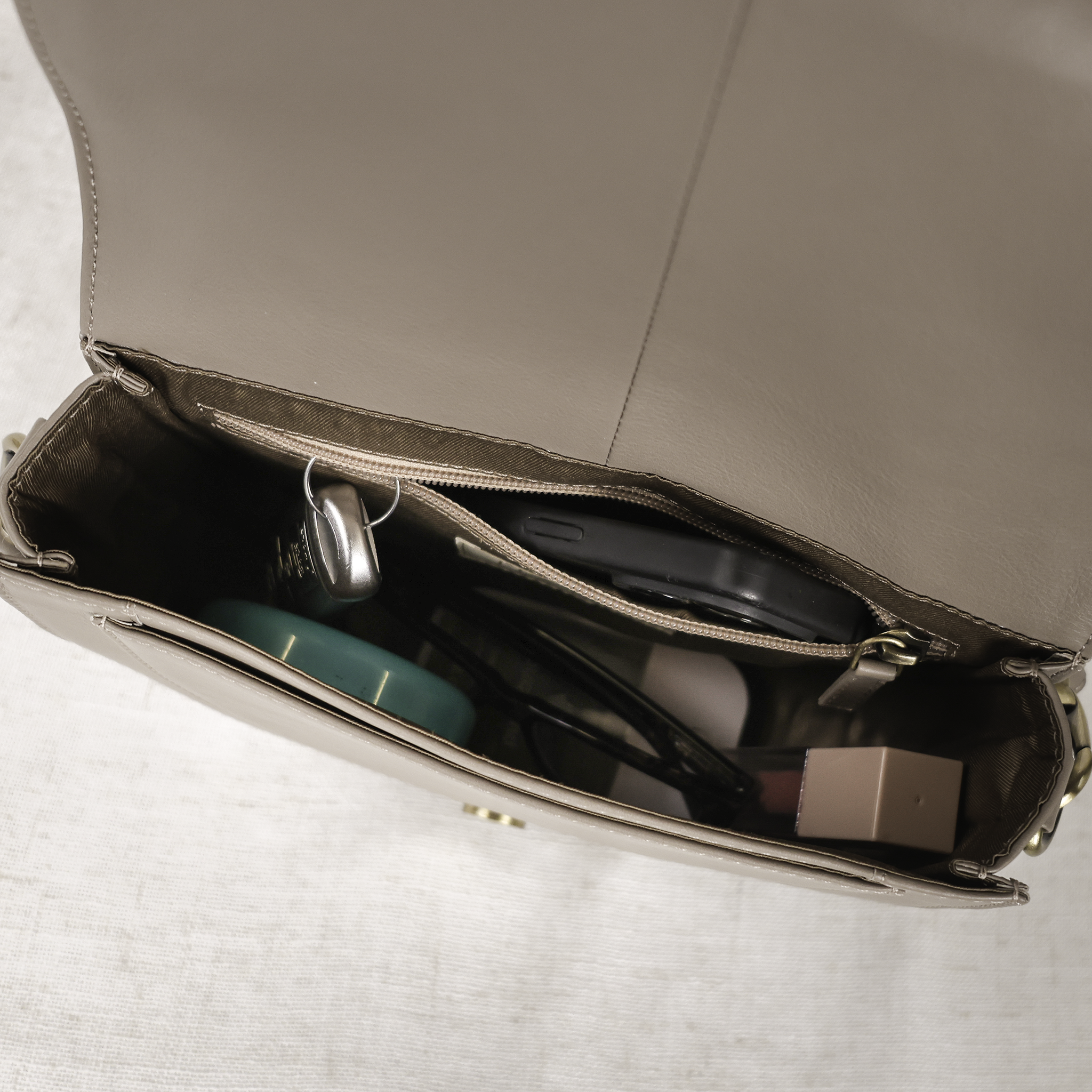 Woven crossbody straps paired with the Stella Leather Saddle Bag, enhancing its versatility and style for a relaxed look.