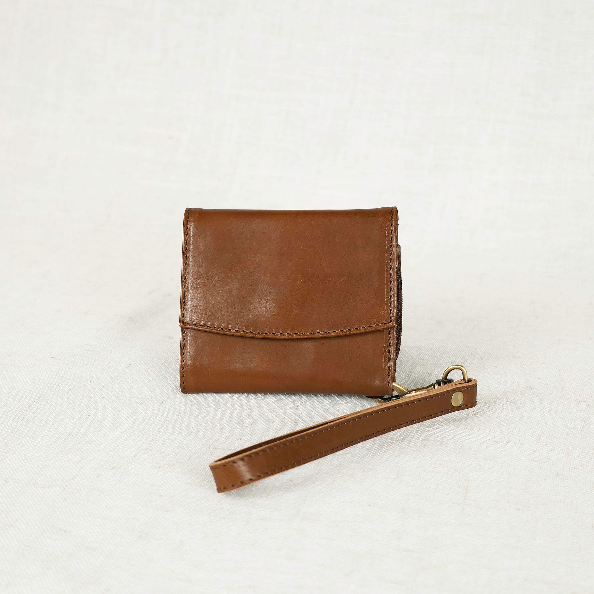 Inside view of the Suri Wallet featuring organized card slots and a zippered coin compartment, a must-have leather wallet for women.