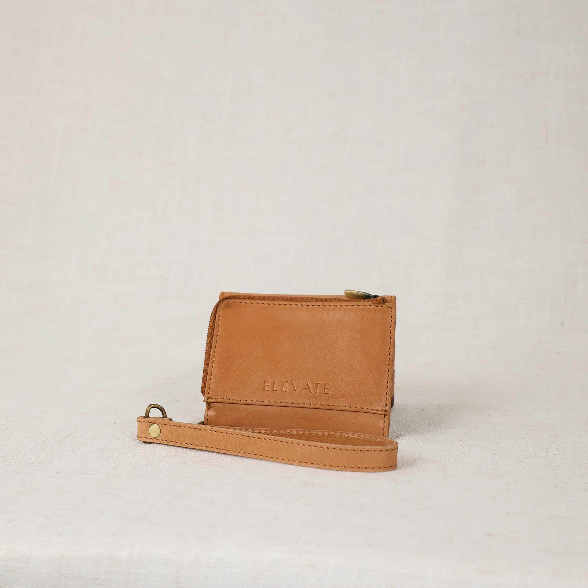 Elegant Suri Wallet on a flat surface, showcasing its luxurious leather finish, perfect for women who appreciate quality leather wallets.