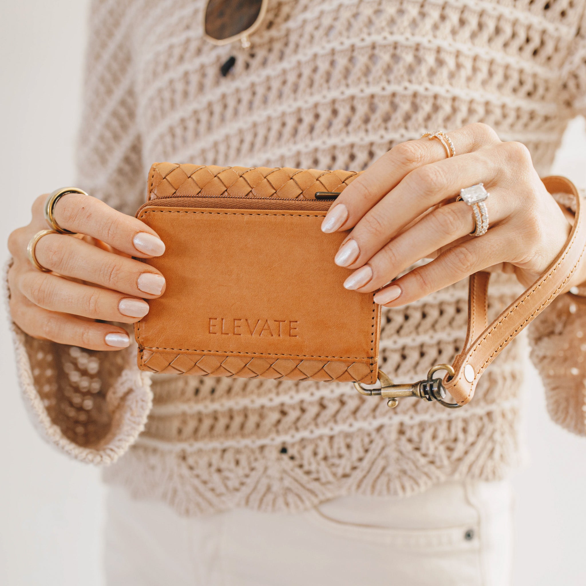 Full view of the Suri Woven Leather Wallet illustrating its compact size of 4.25" W x 4" H.